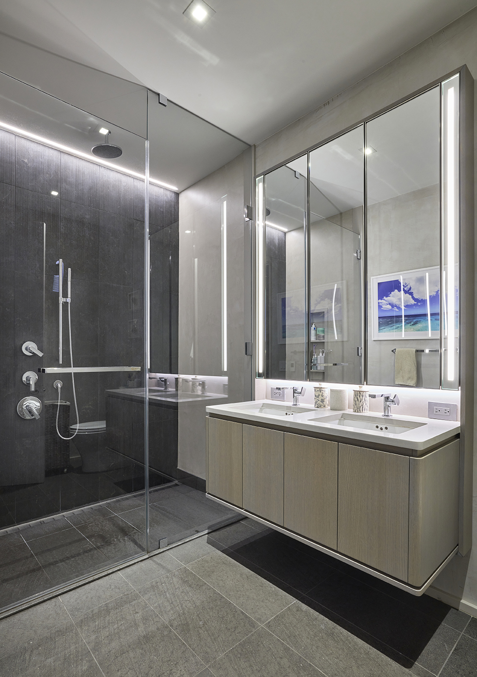 77 Charlton Street, Unit N10C Manhattan, NY 10014 - Photo 6 of 24 a bathroom with a double vanity sink mirror and shower