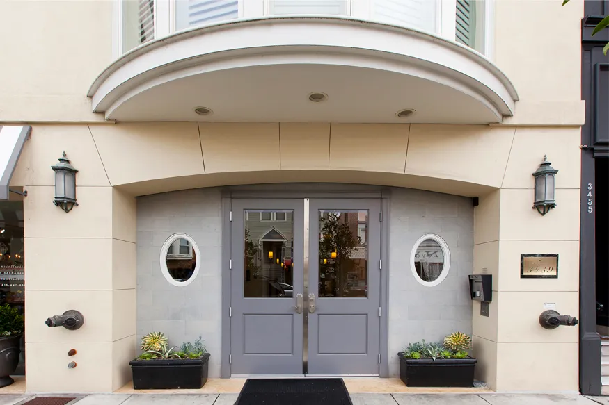 a view of door of house with wooden fence