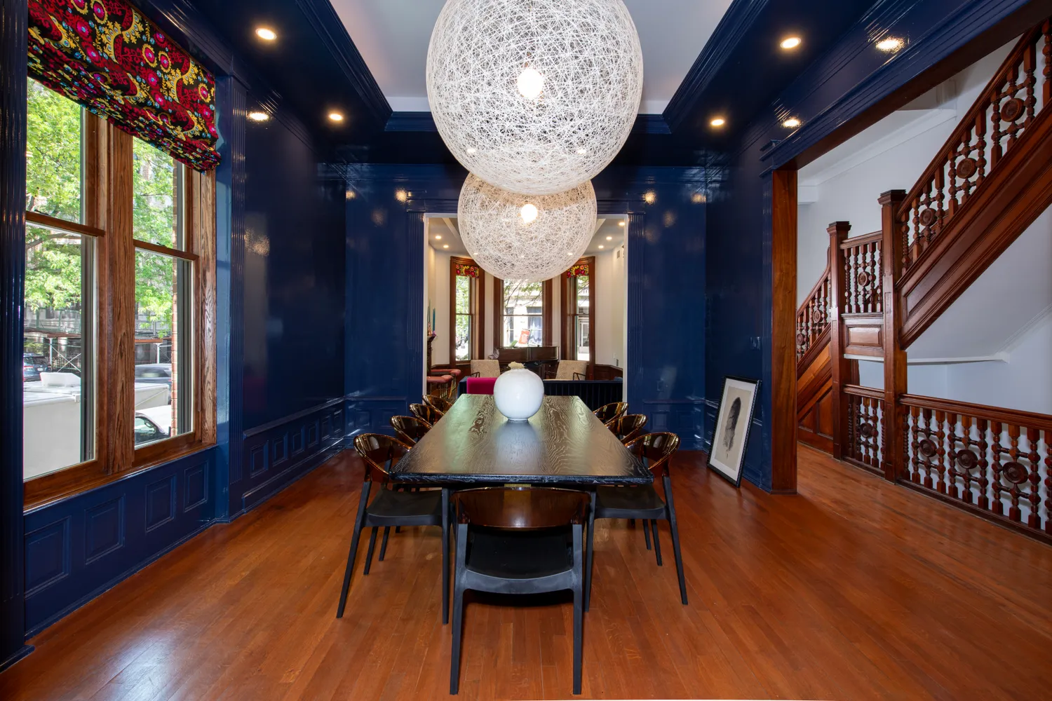 a dining room with furniture and wooden floor