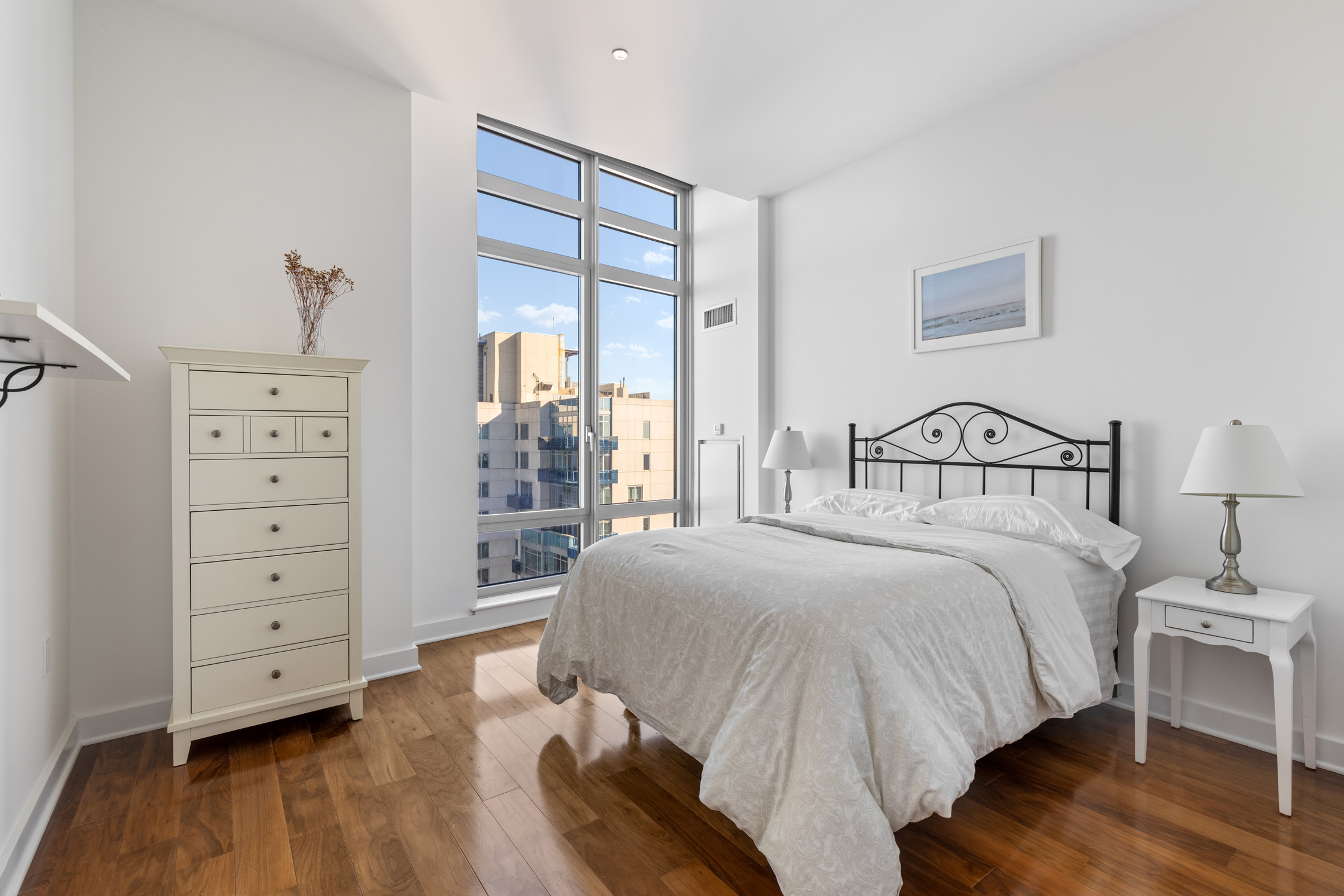 2 Northside Piers, Unit 31P Brooklyn, NY 11249 - Photo 8 of 16 a bedroom with a bed and a closet