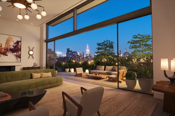 a living room with furniture potted plant and a large window