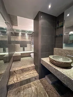 a bathroom with a double vanity sink and a mirror