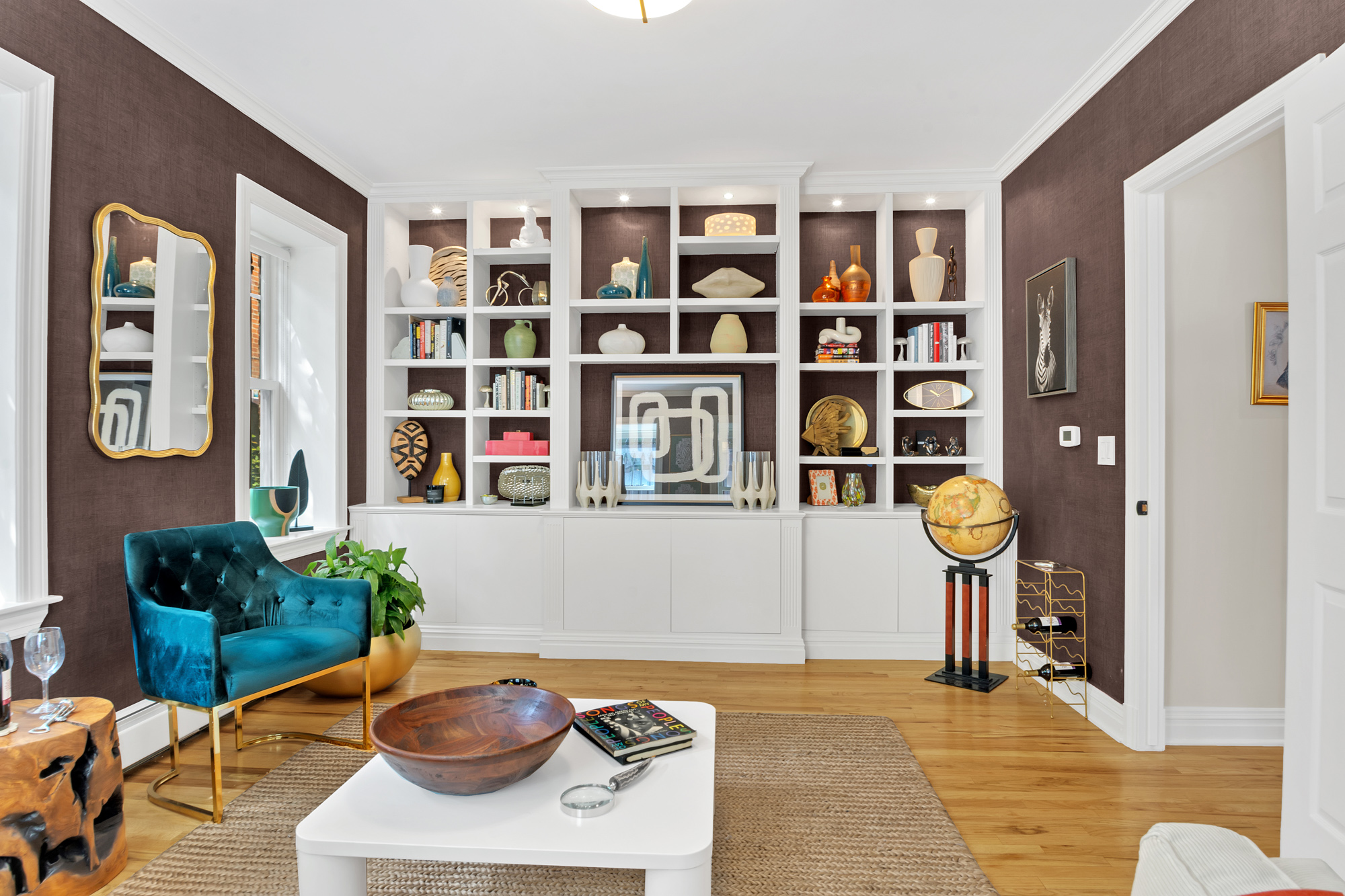 1 Mount Morris Park West, Unit 1A Manhattan, NY 10027 - Photo 5 of 12 a living room with fish tank and a bookshelf