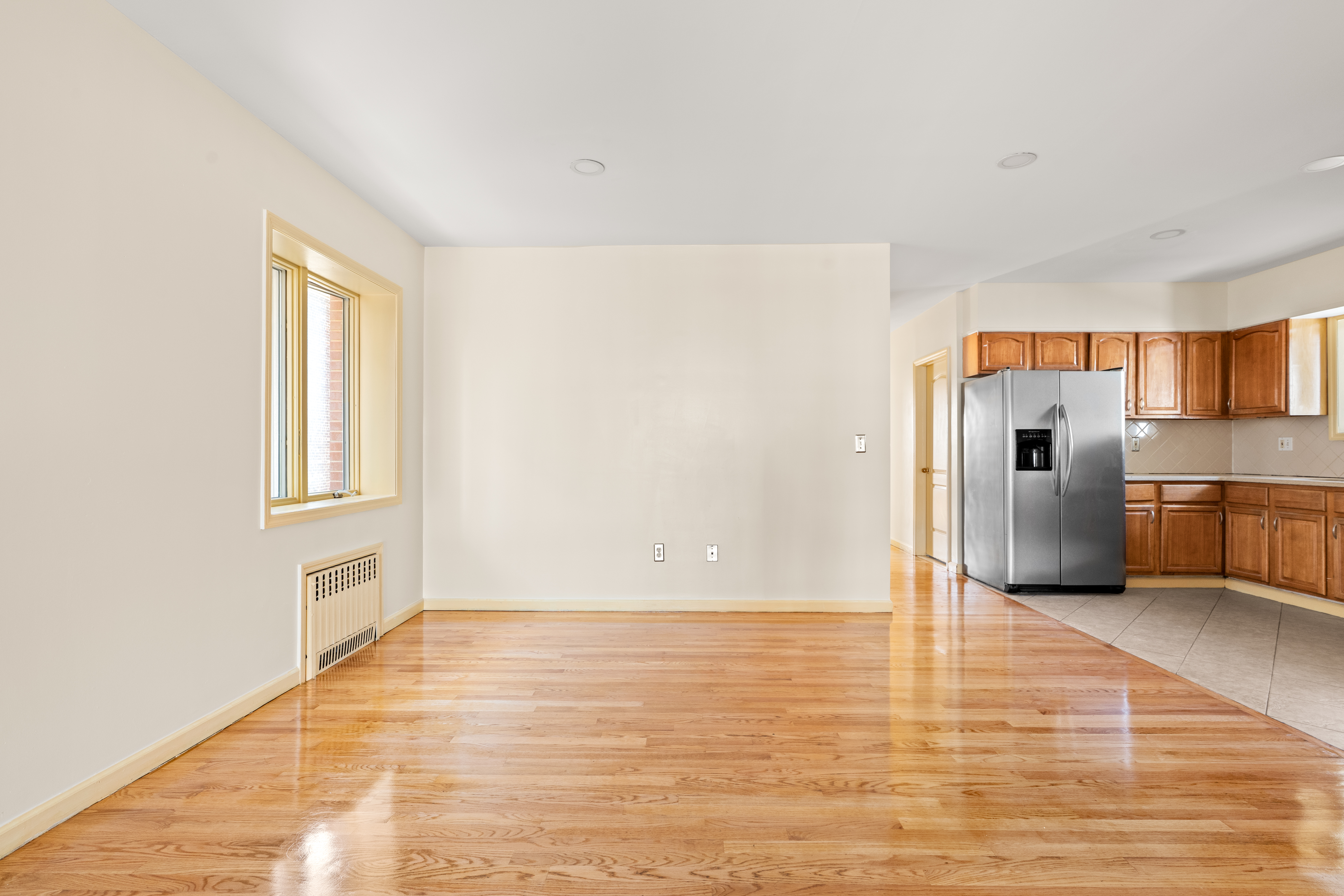 1920 83rd Street, Unit 3 Brooklyn, NY 11214 - Photo 2 of 9 a view of a kitchen with a sink and a refrigerator