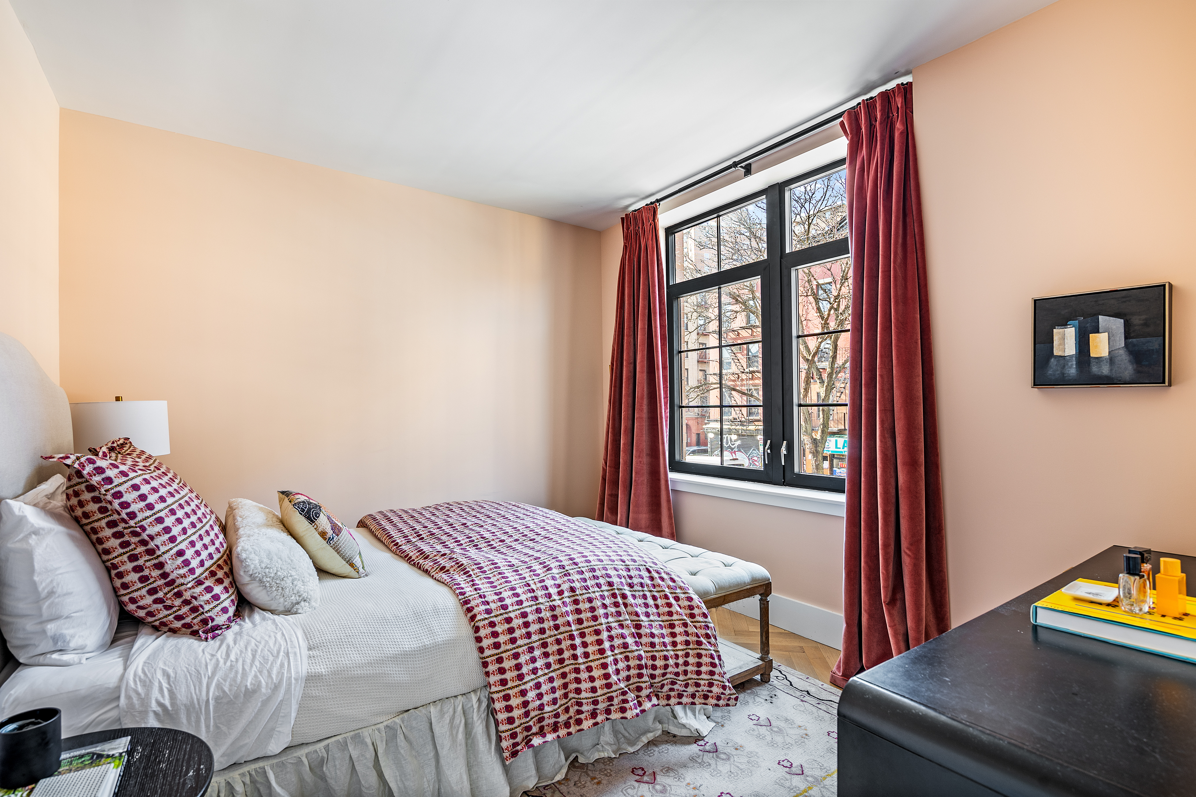 100 Avenue A, Unit 2B Manhattan, NY 10009 - Photo 4 of 11 a bedroom with a bed and a window