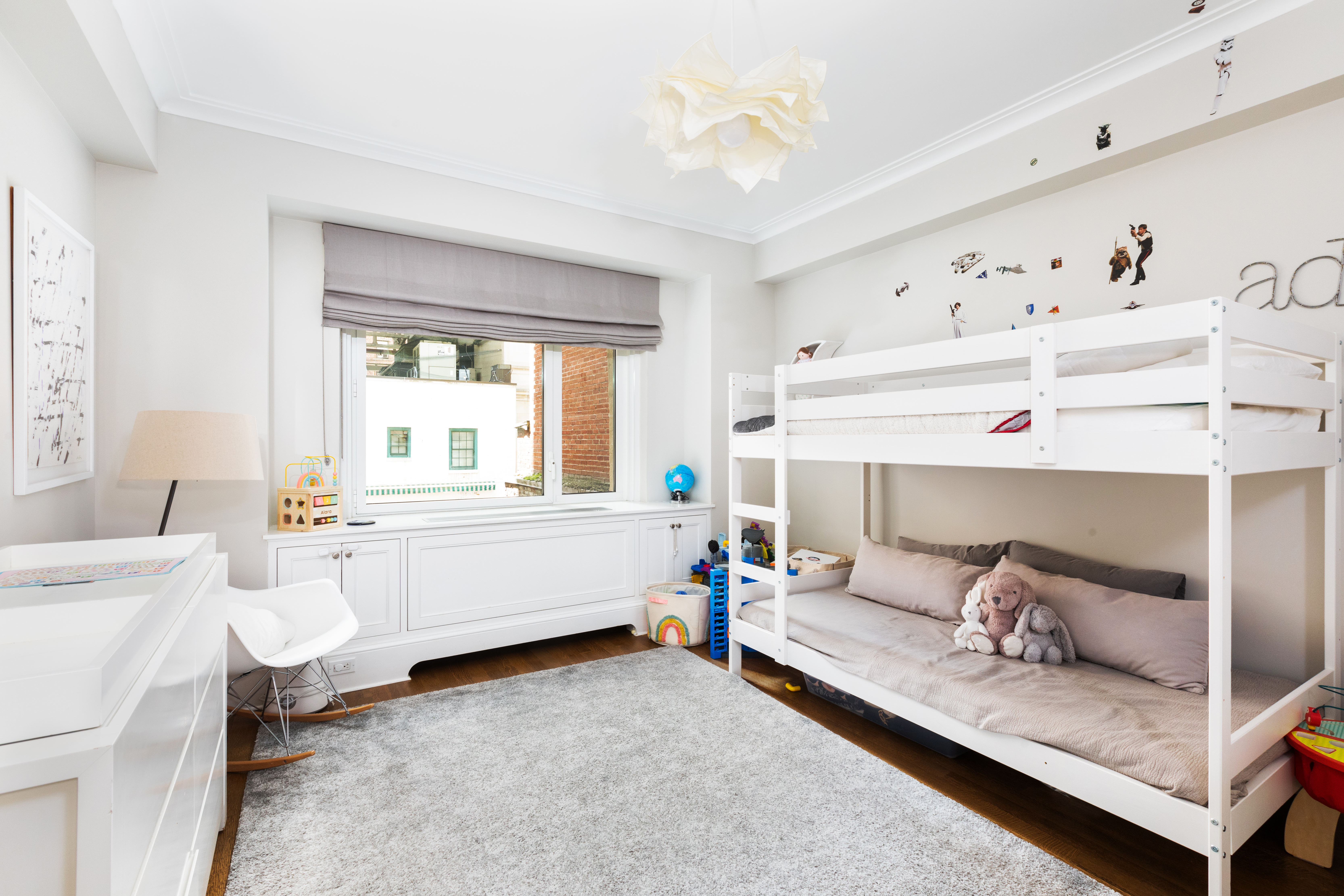 530 Park Avenue, Unit 7G Manhattan, NY 10065 - Photo 9 of 16 a living room with furniture and a window