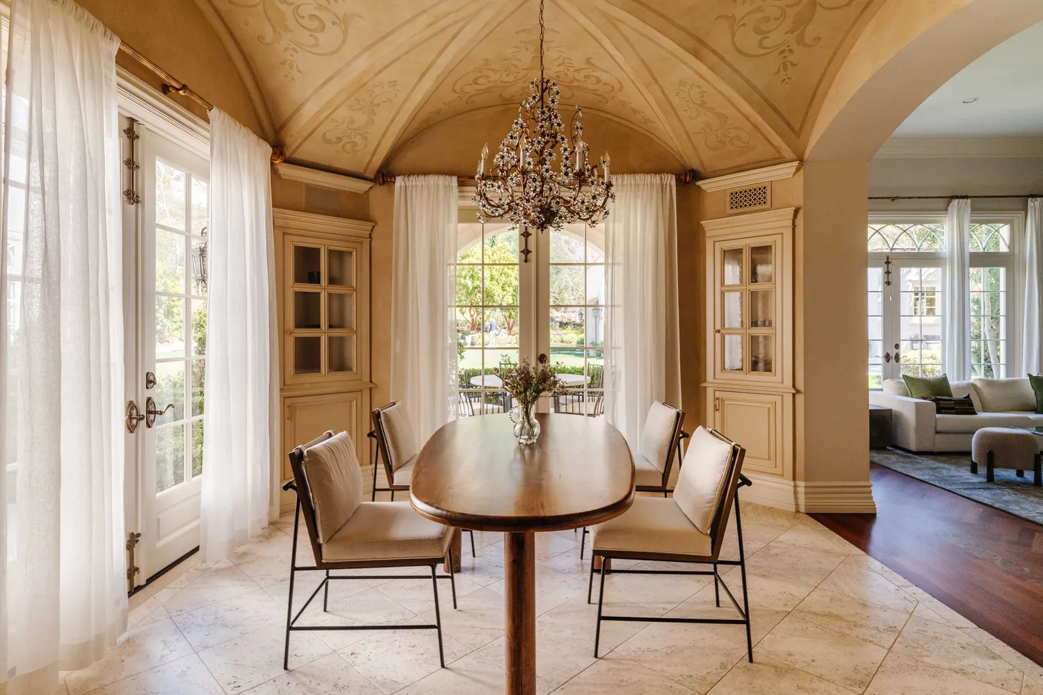 a dining room with furniture and wooden floor