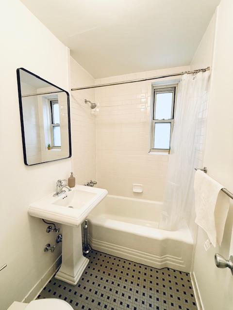 221 McDonald Avenue, Unit 2R Brooklyn, NY 11218 - Photo 7 of 8 a bathroom with a sink toilet and shower