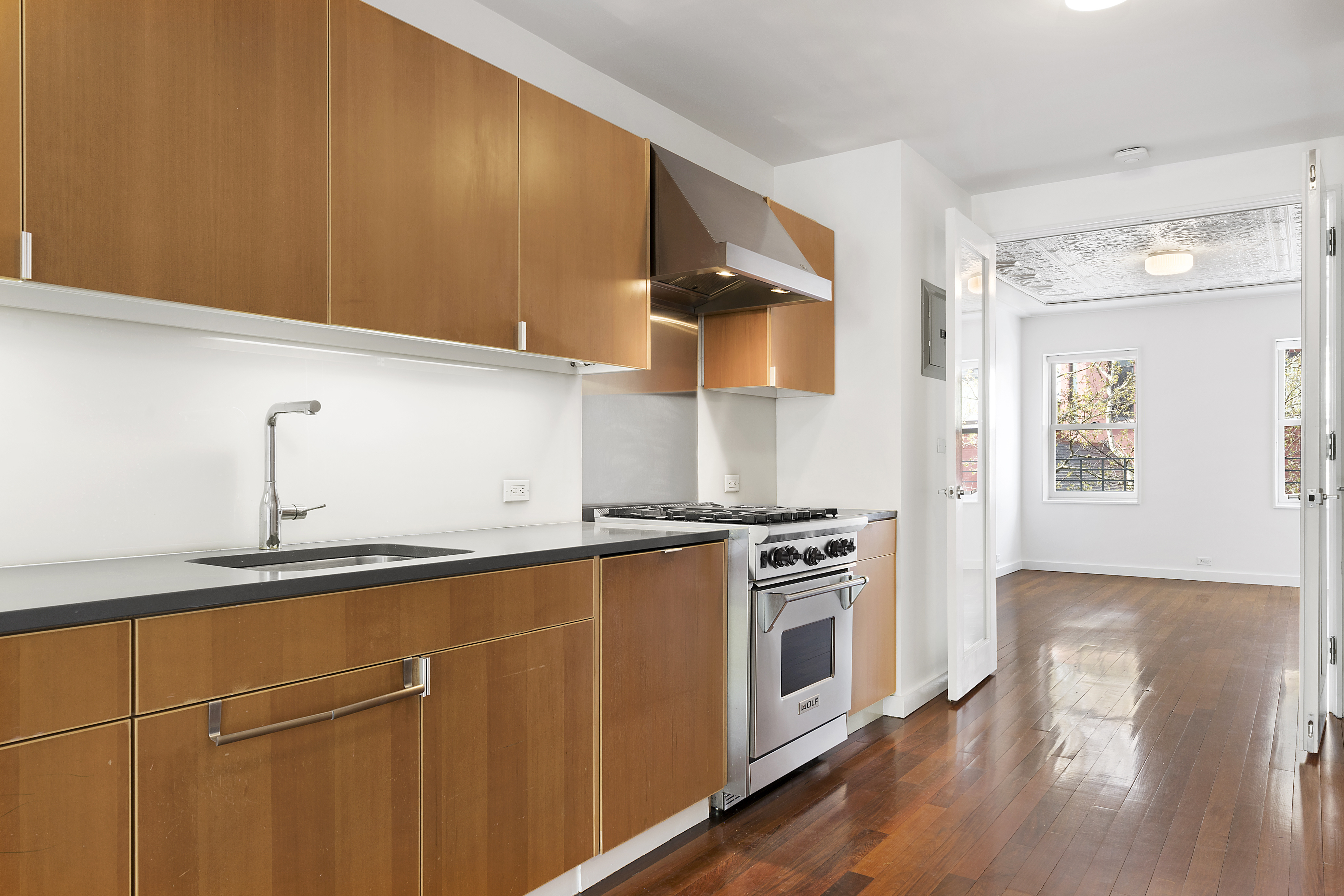 191 Luquer Street, Unit 3B Brooklyn, NY 11231 - Photo 4 of 7 a kitchen with stainless steel appliances granite countertop a stove and a sink