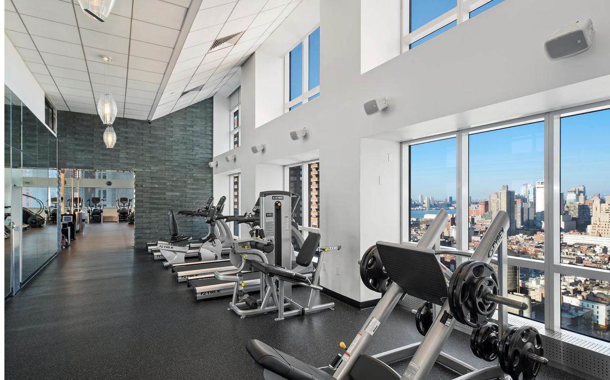 350 West 42nd Street, Unit 5D Manhattan, NY 10036 - Photo 7 of 13 a view of a room with gym equipment
