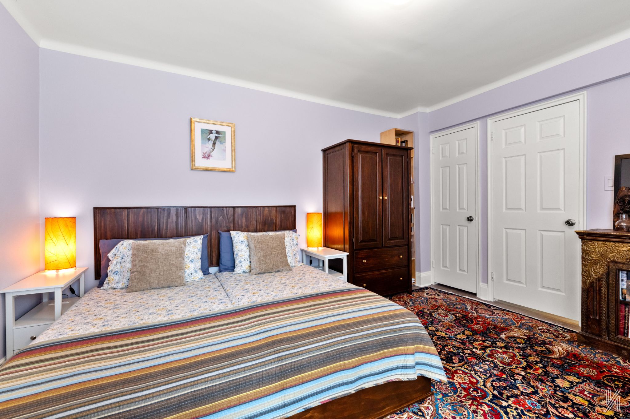 34-41 85th Street, Unit 1X Queens, NY 11372 - Photo 12 of 24 a bedroom with a bed and a television