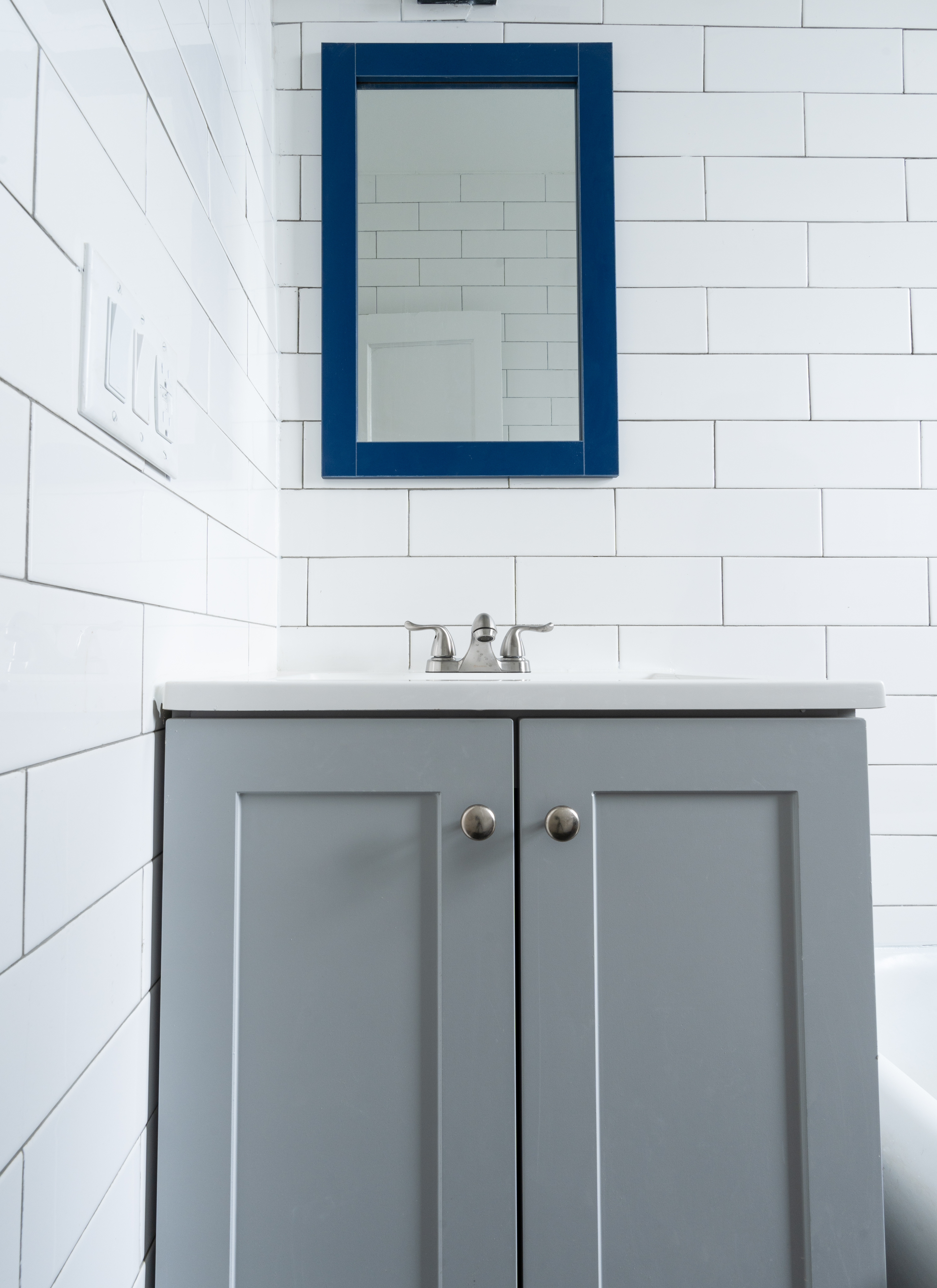 1405 Prospect Place, Unit B11 Brooklyn, NY 11213 - Photo 9 of 12 a bathroom with a sink and a mirror