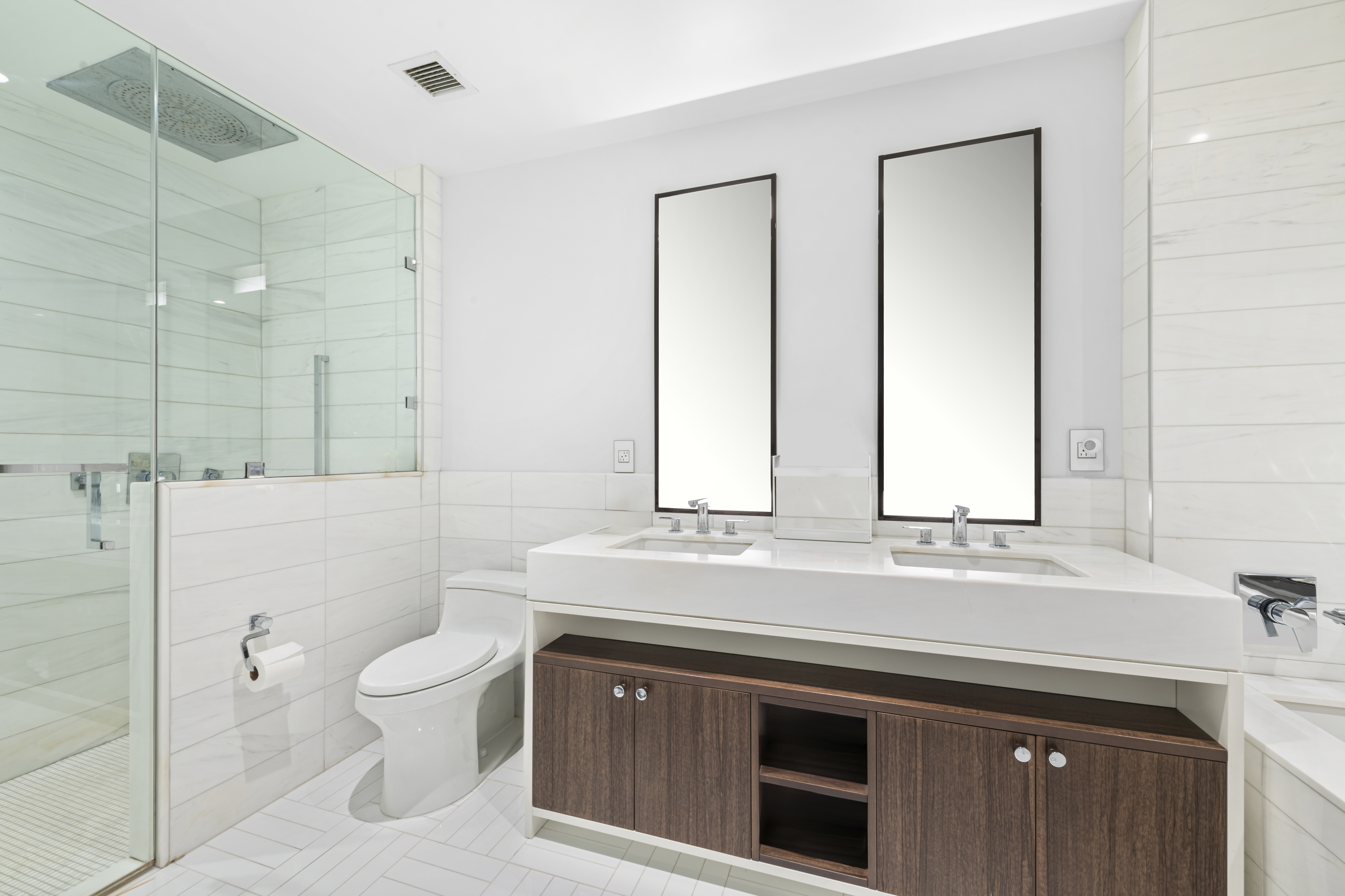 261 West 25th Street, Unit 4D Manhattan, NY 10001 - Photo 7 of 14 a bathroom with a sink a toilet and a mirror