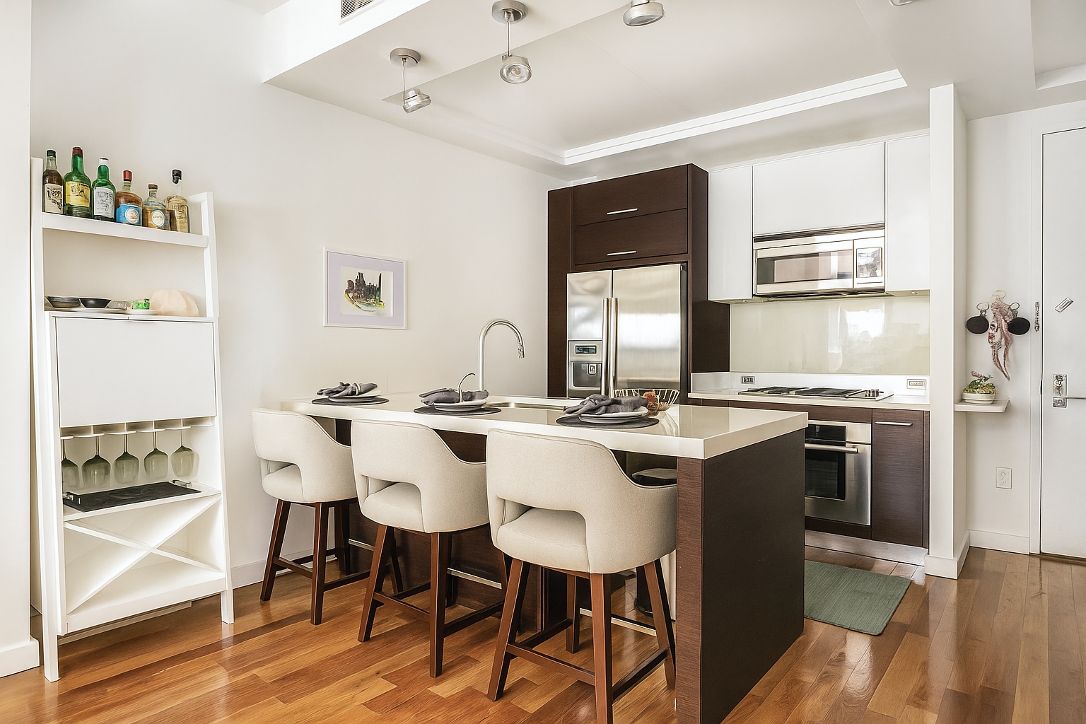 161 North 4th Street, Unit 1F Brooklyn, NY 11211 - Photo 2 of 10 a kitchen with a sink and chairs