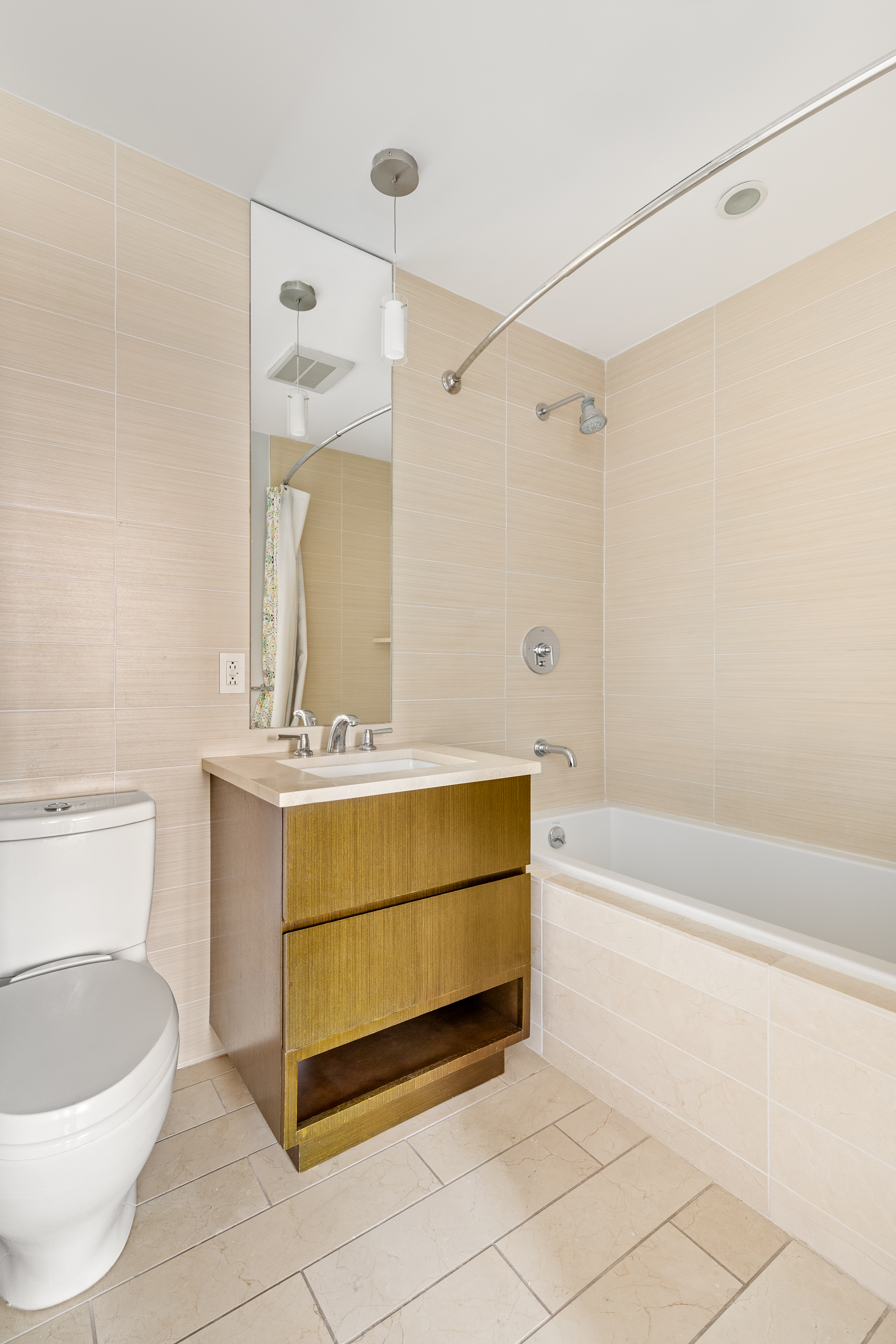2300 Frederick Douglass Boulevard, Unit 9F Manhattan, NY 10027 - Photo 8 of 15 a bathroom with a granite countertop sink a toilet and bathtub