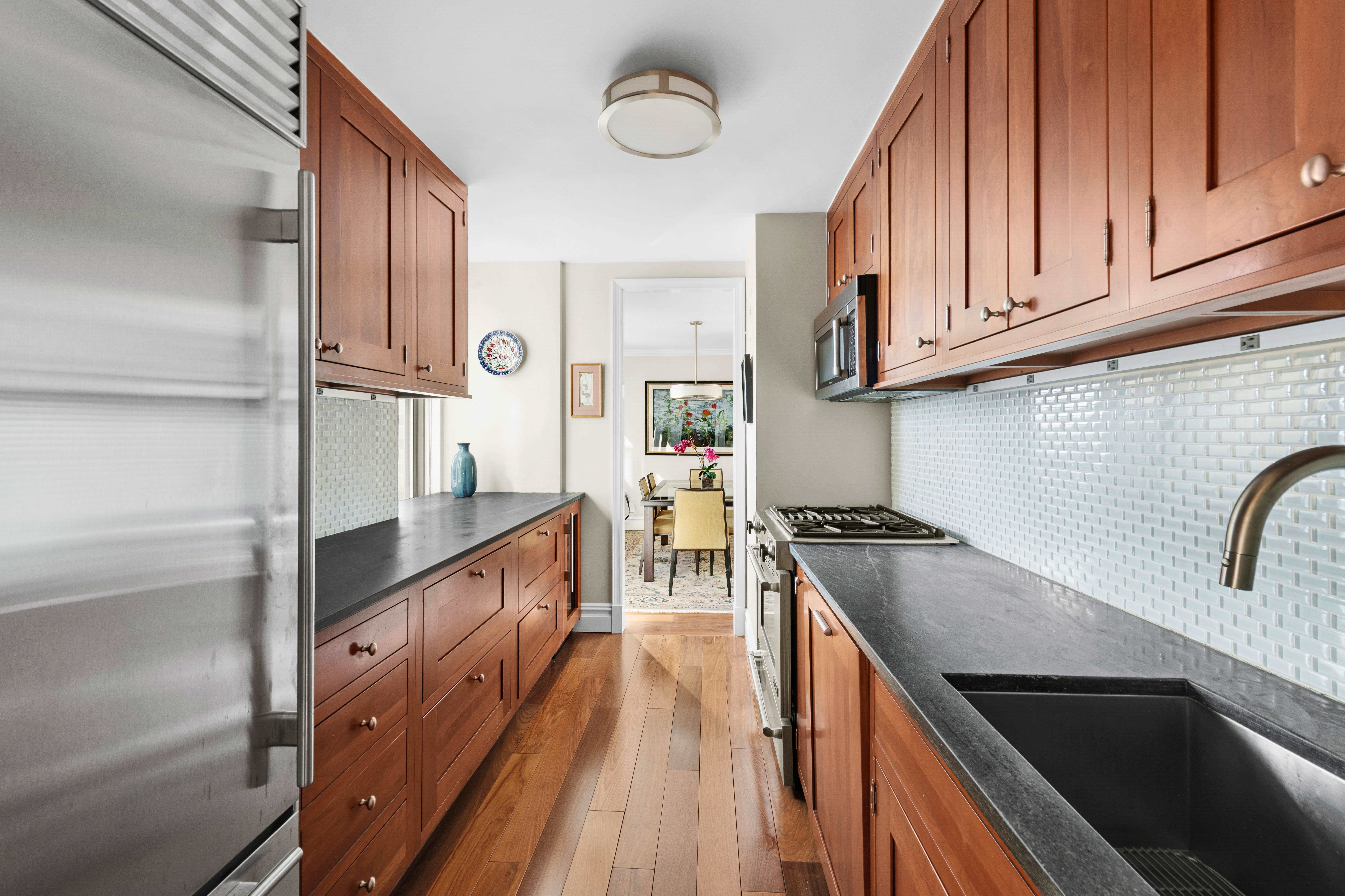 444 East 86th Street, Unit 25EF Manhattan, NY 10028 - Photo 4 of 18 a kitchen with cabinets and a stove