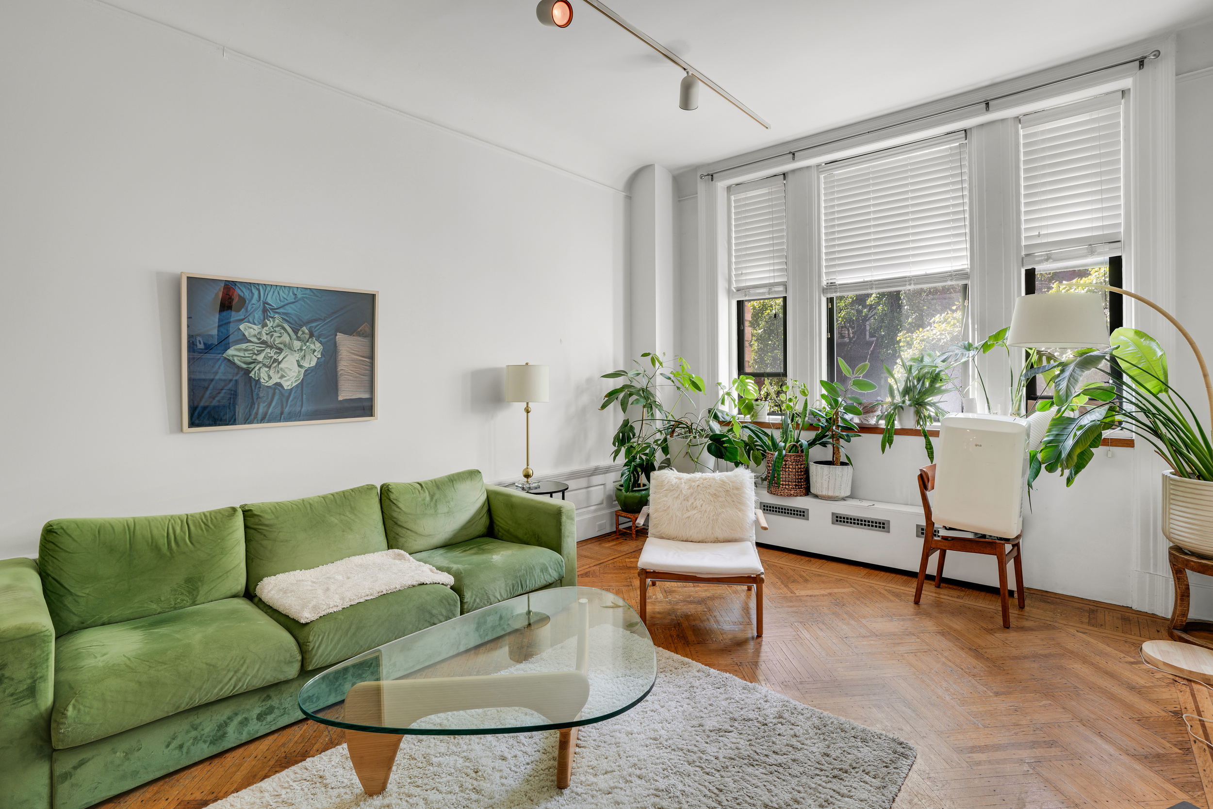 337 West 71st Street, Unit 3 Manhattan, NY 10023 - Photo 1 of 9 a living room with furniture and a potted plant