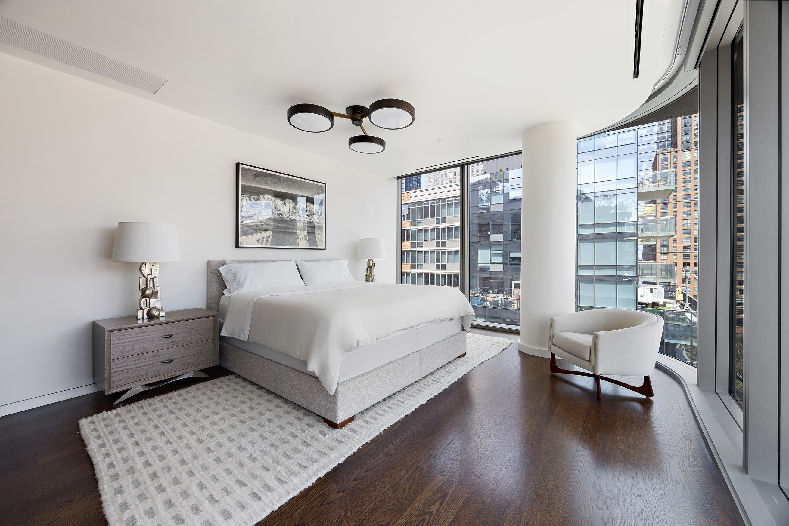 520 West 28th Street, Unit PH37 Manhattan, NY 10001 - Photo 28 of 45 a bedroom with a bed and glass window