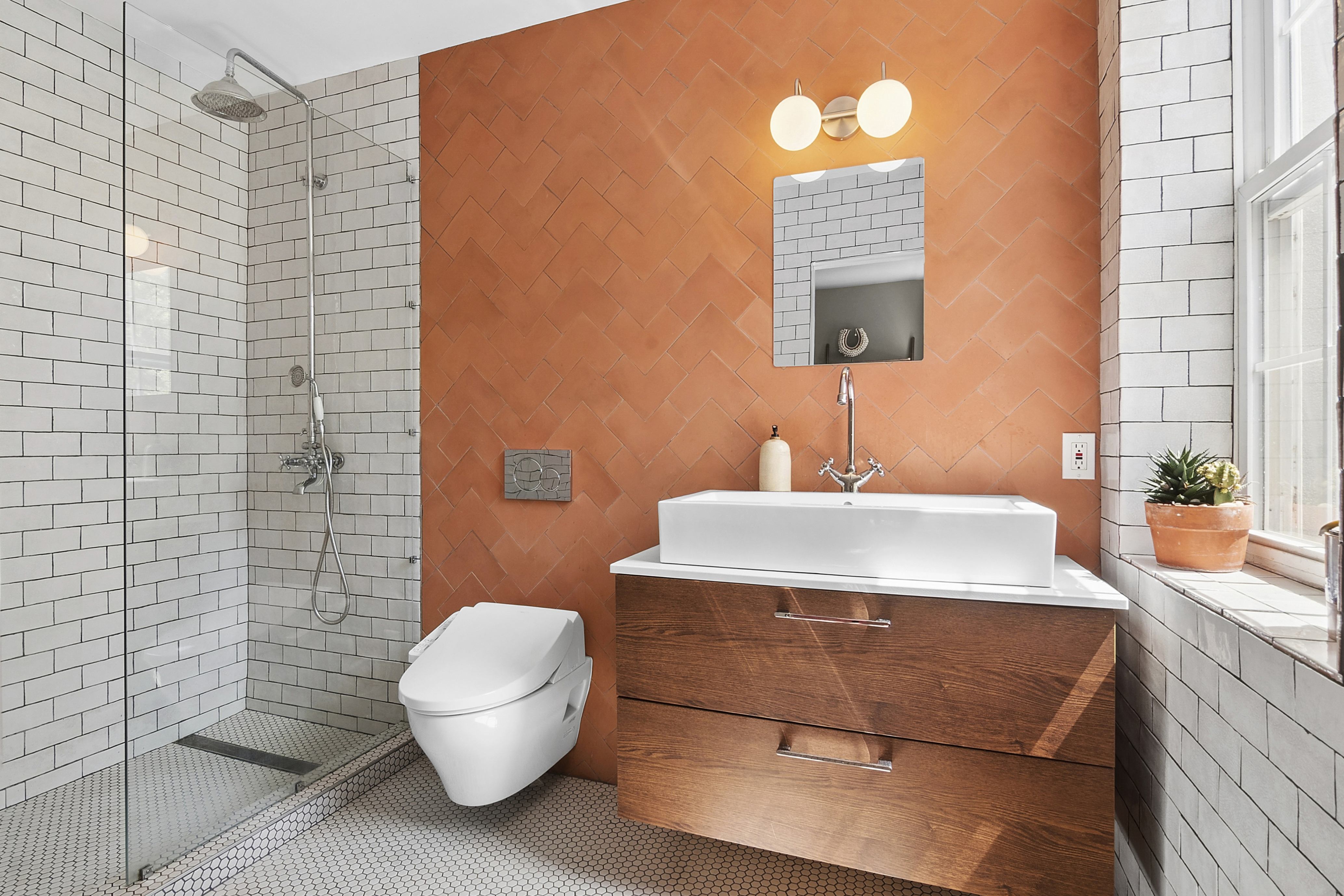 190 Concord Street Brooklyn, NY 11201 - Photo 7 of 14 a bathroom with a sink a toilet and mirror