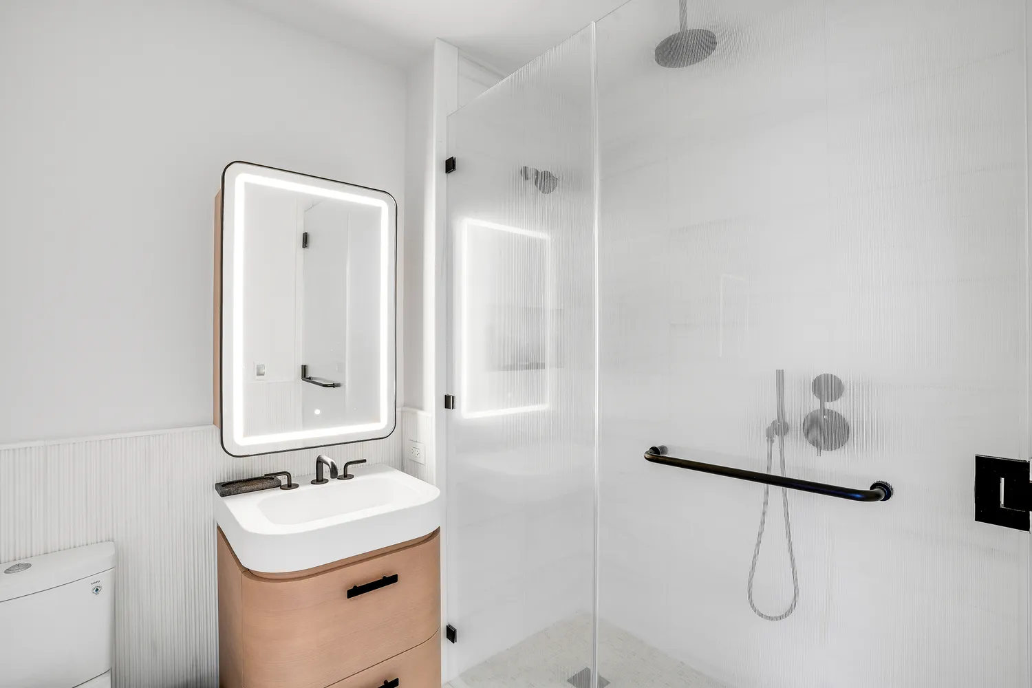 a bathroom with a sink vanity and mirror