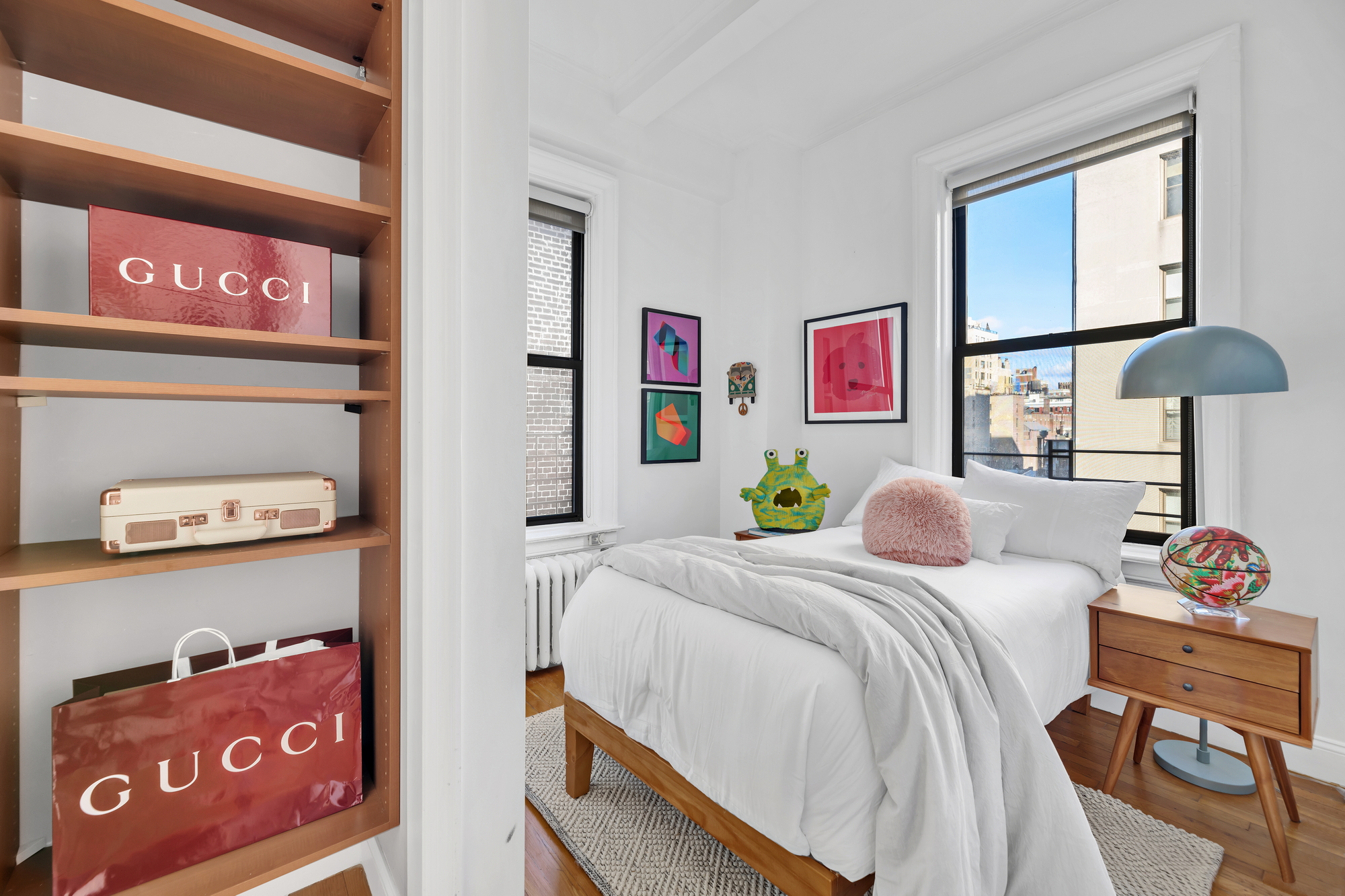 599 West End Avenue, Unit 7BC Manhattan, NY 10024 - Photo 8 of 11 a bedroom with a bed and a lamp on dresser next to a window