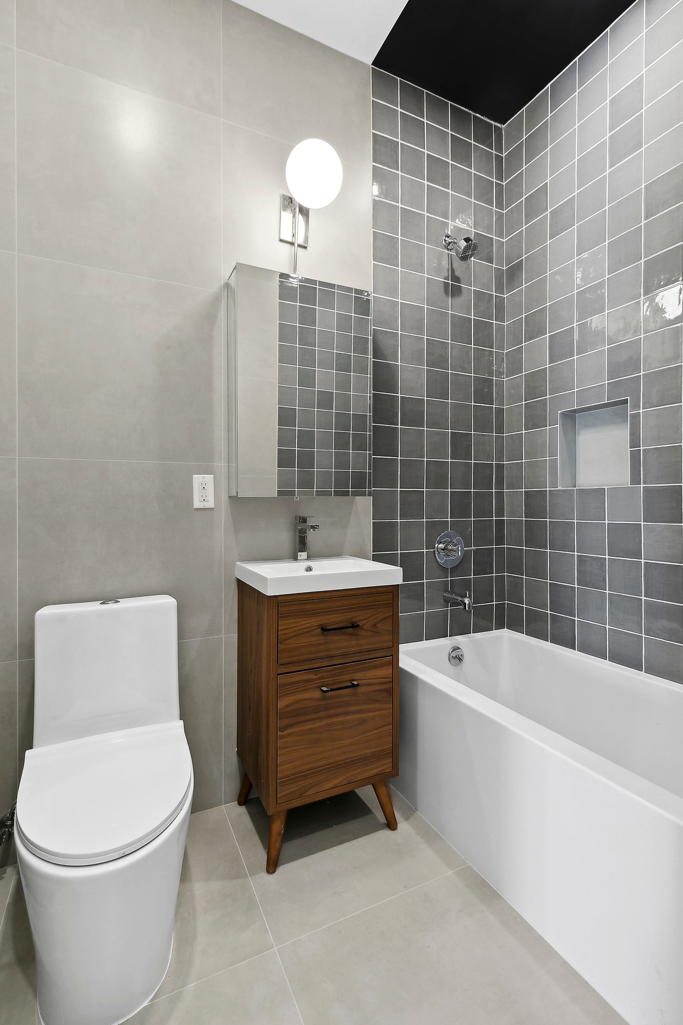 138 Schaefer Street, Unit 3A Brooklyn, NY 11207 - Photo 5 of 10 a bathroom with a sink a toilet and bathtub