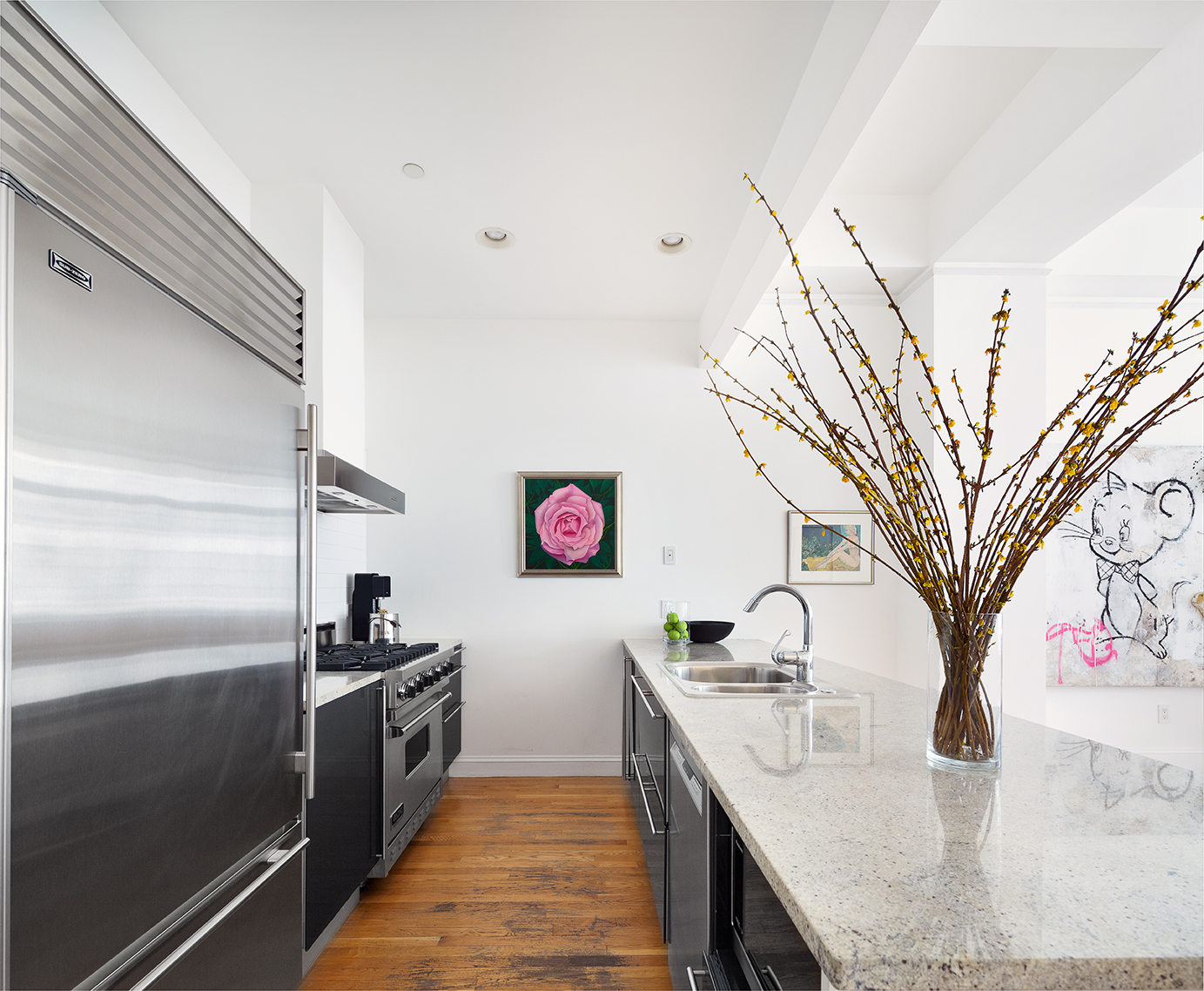129 Lafayette Street, Unit 3B Manhattan, NY 10013 - Photo 7 of 13 a kitchen with kitchen island a sink appliances and cabinets
