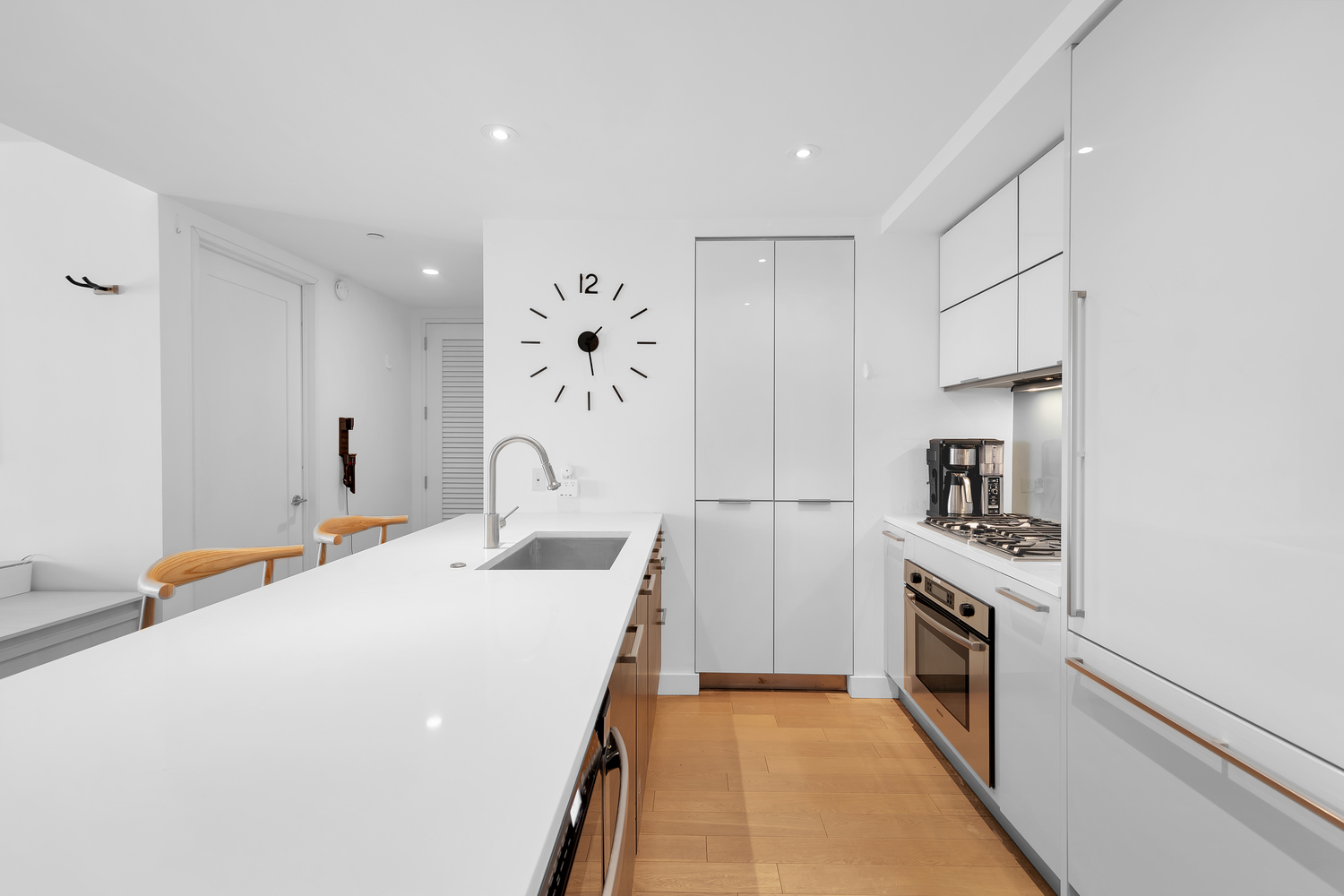 34 North 7th Street, Unit 6Y Brooklyn, NY 11249 - Photo 4 of 20 a kitchen with stainless steel appliances a stove a sink and a refrigerator