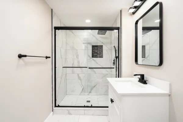 a bathroom with a sink and a mirror