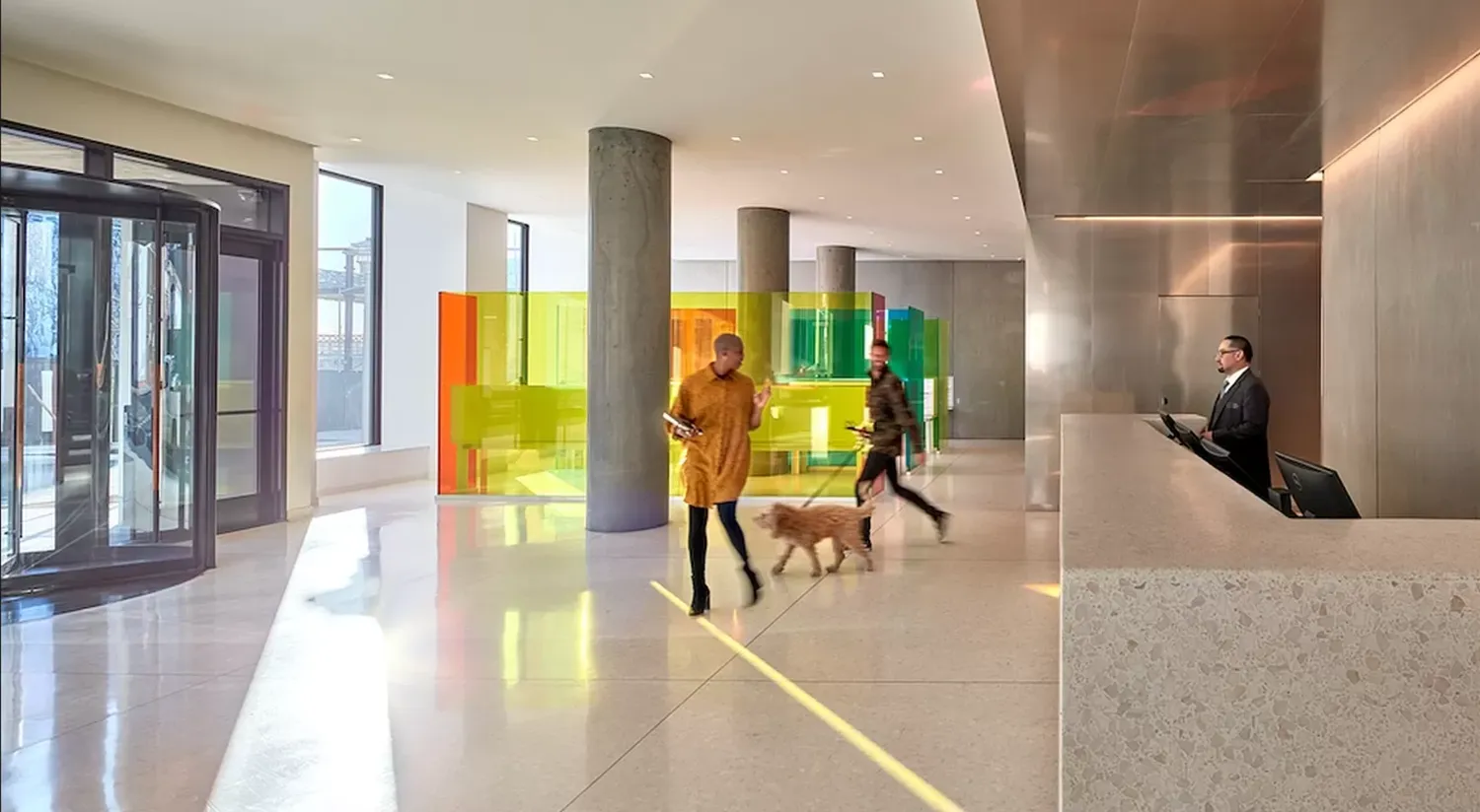 a lobby with furniture and floor to ceiling window