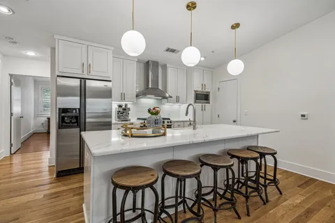 a kitchen with a stove and a sink