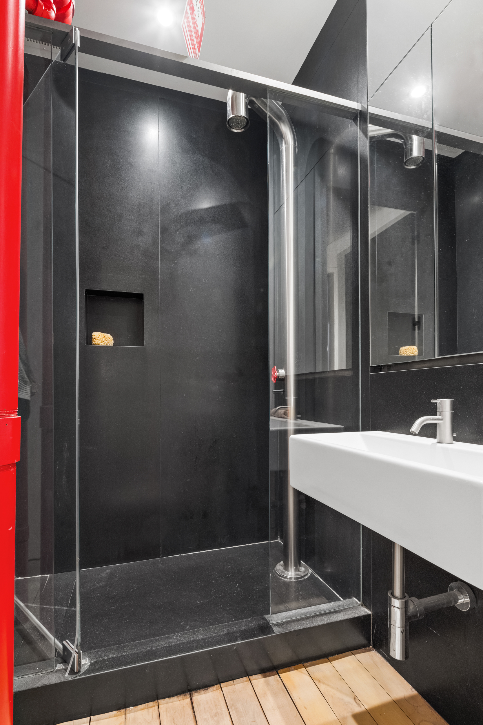 144 Franklin Street, Unit 3 Manhattan, NY 10013 - Photo 20 of 23 a bathroom with a shower and a mirror