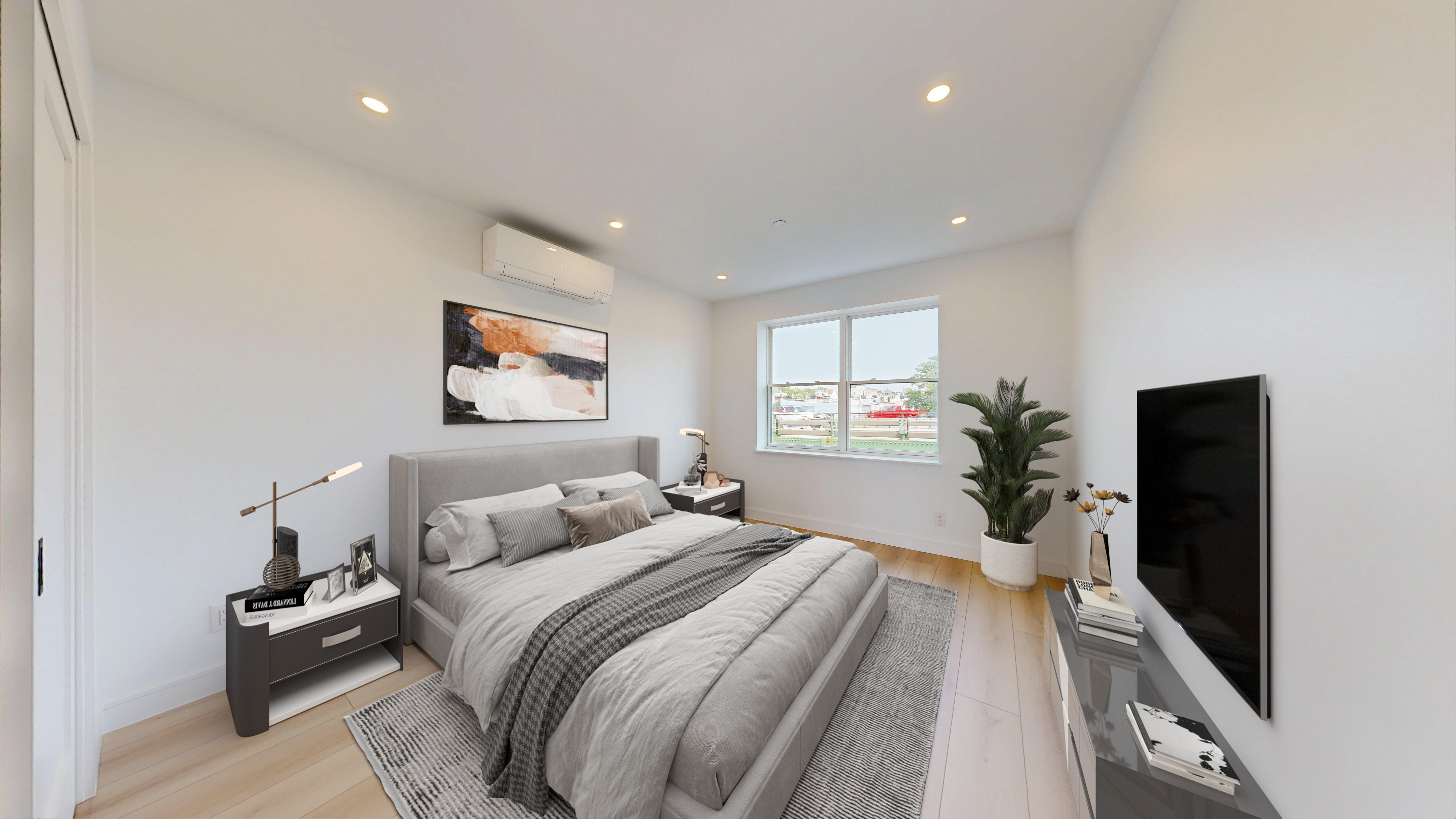 5614 3rd Avenue, Unit 3 Brooklyn, NY 11220 - Photo 6 of 11 a bedroom with a bed and a flat screen tv