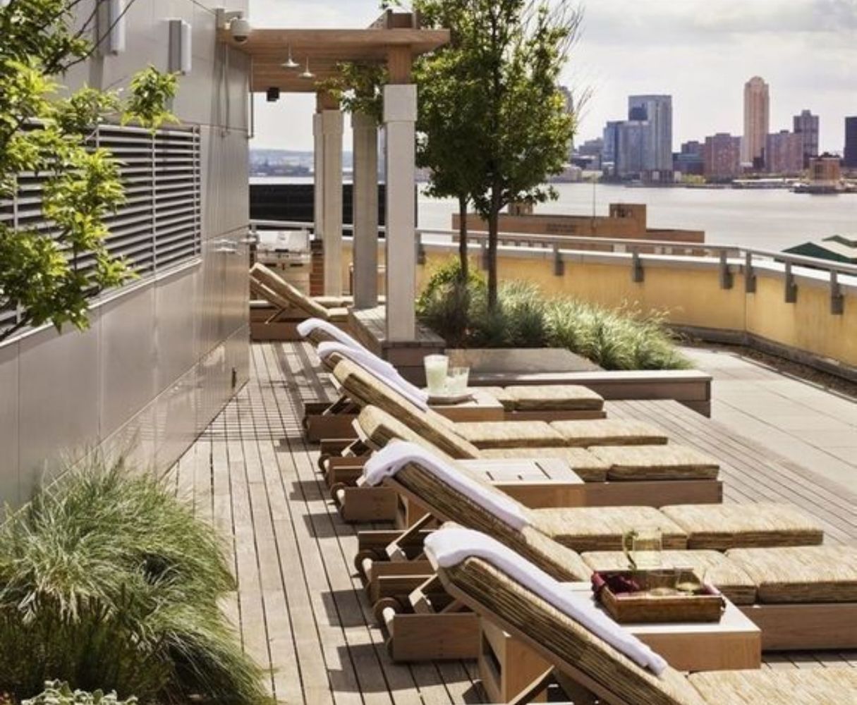 a view of a balcony with two chairs and a table
