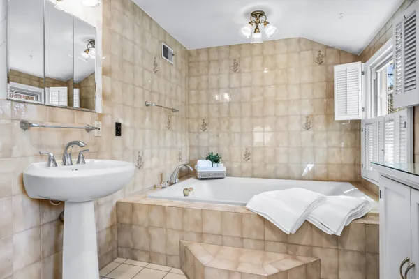 a view of a house with garden and trees