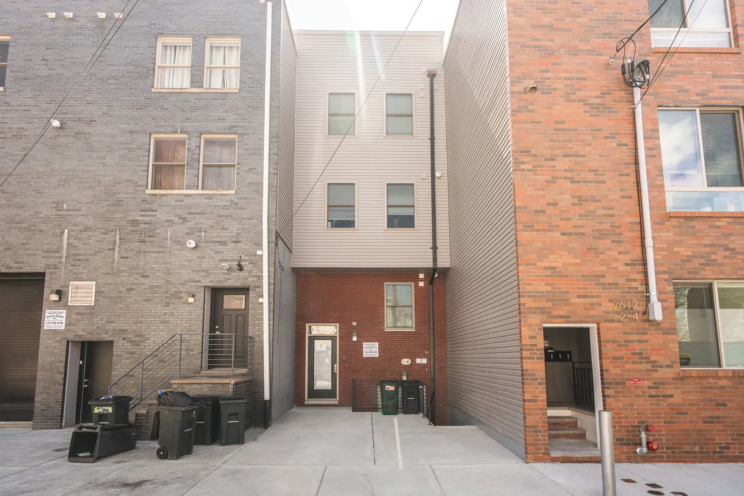a view of a brick house with many windows