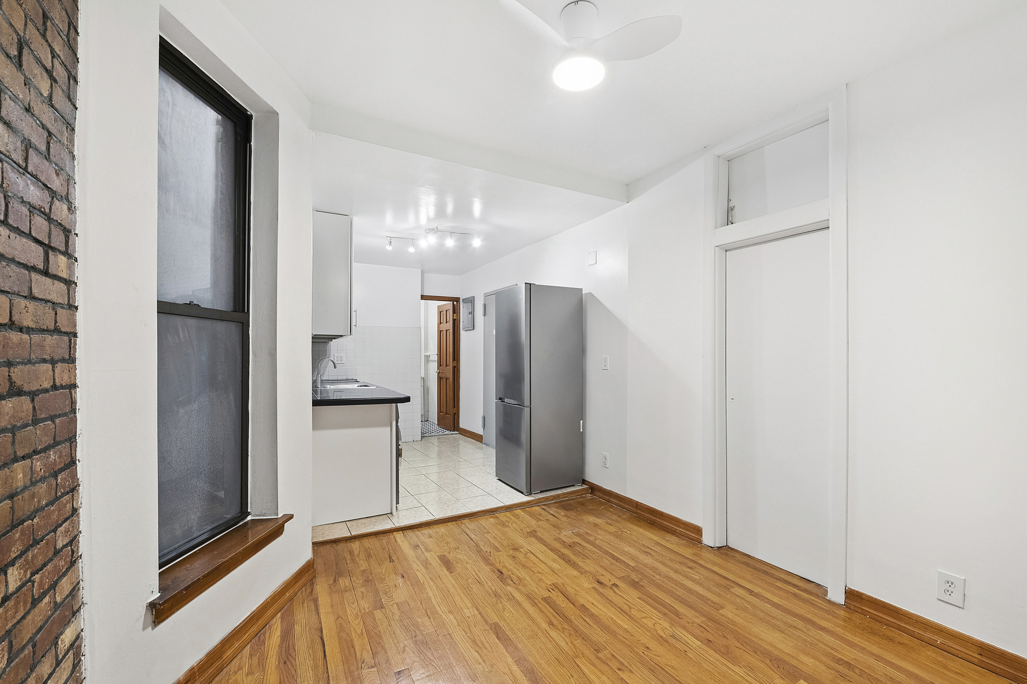 5 Cornelia Street, Unit 5B Manhattan, NY 10014 - Photo 5 of 7 a view of a kitchen from the hallway