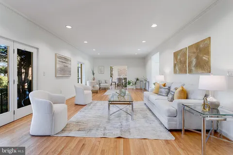 a living room with furniture fireplace and a flat screen tv