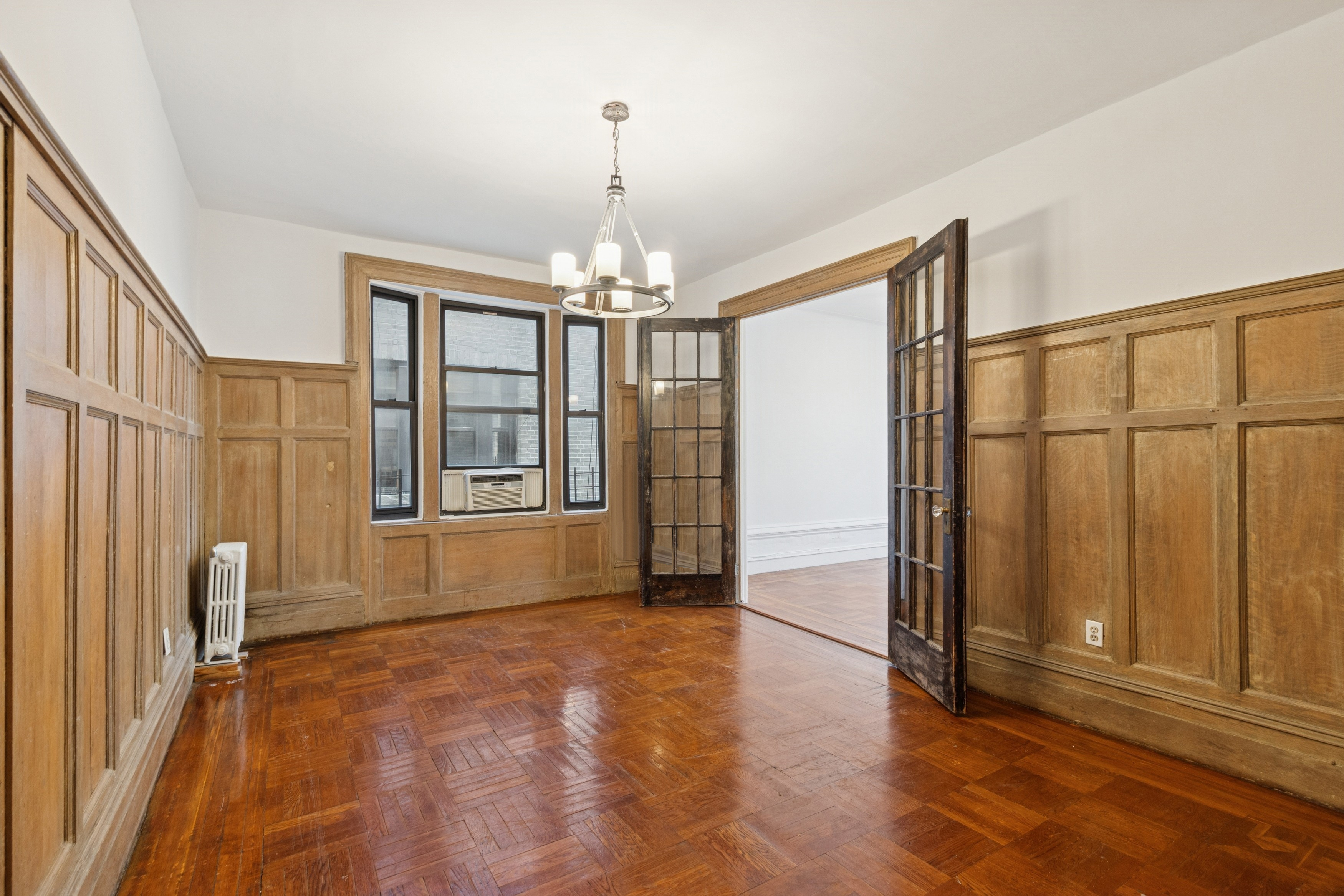 804 West 180th Street, Unit 41 Manhattan, NY 10033 - Photo 7 of 23 a view of a livingroom with wooden floor and staircase