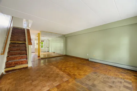 an empty room with a empty space and window