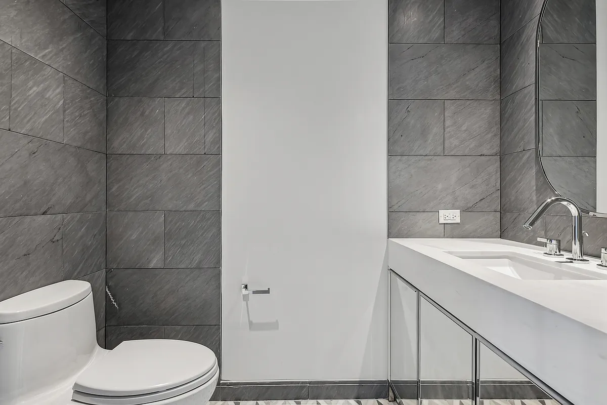 269 West 87th Street, Unit 14A Manhattan, NY 10024 - Photo 14 of 23 a bathroom with a sink a toilet and shower