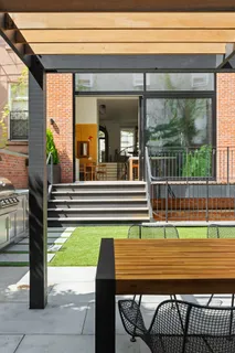 a view of a patio with a table and chairs