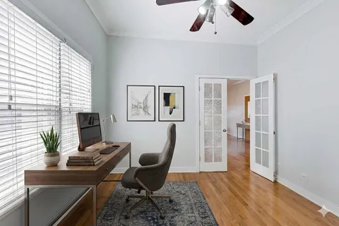 a workspace with furniture and wooden floor