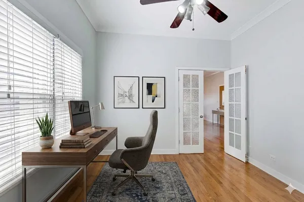 a workspace with furniture and wooden floor