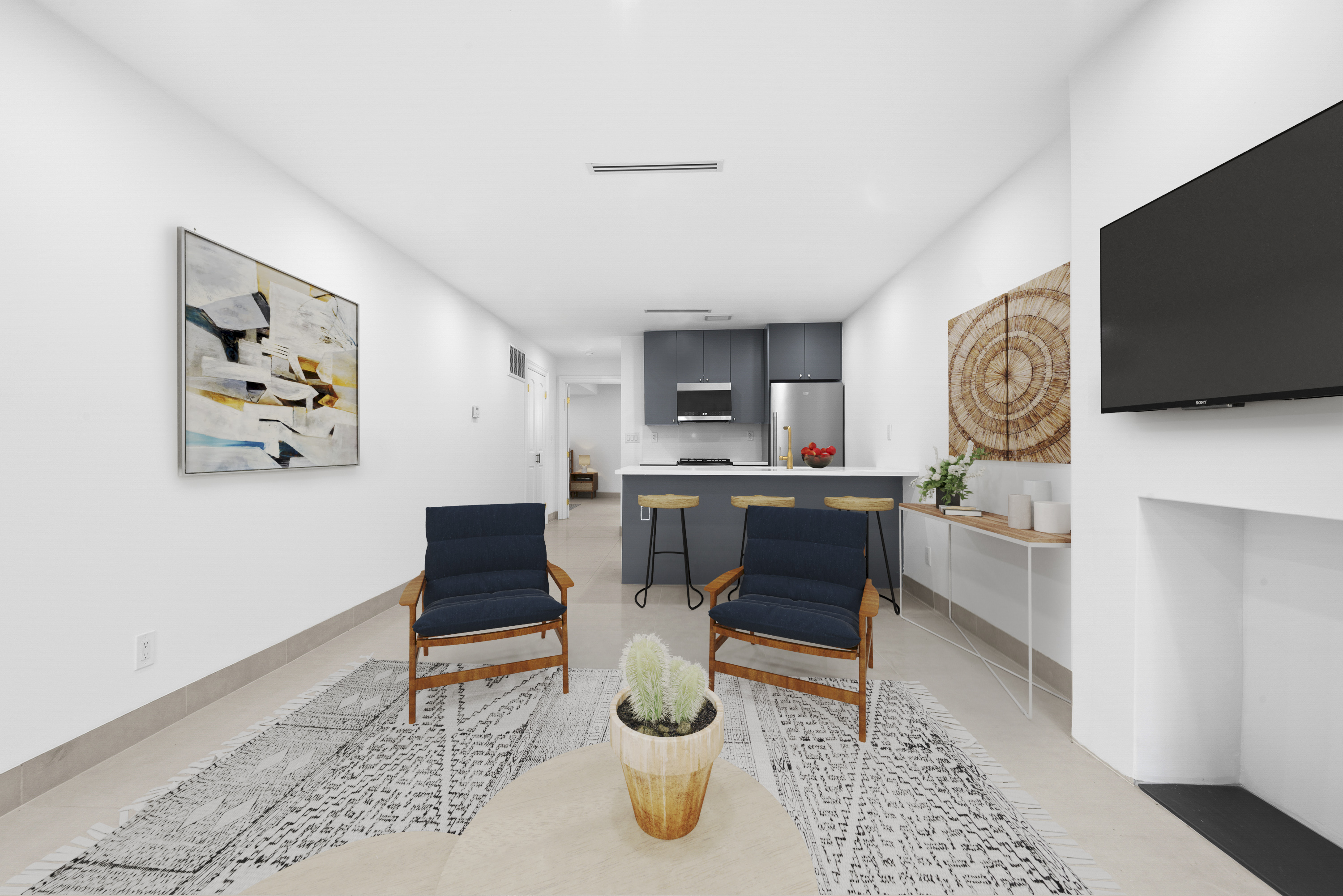 30 Weirfield Street Brooklyn, NY 11221 - Photo 24 of 29 a living room with kitchen furniture and a flat screen tv