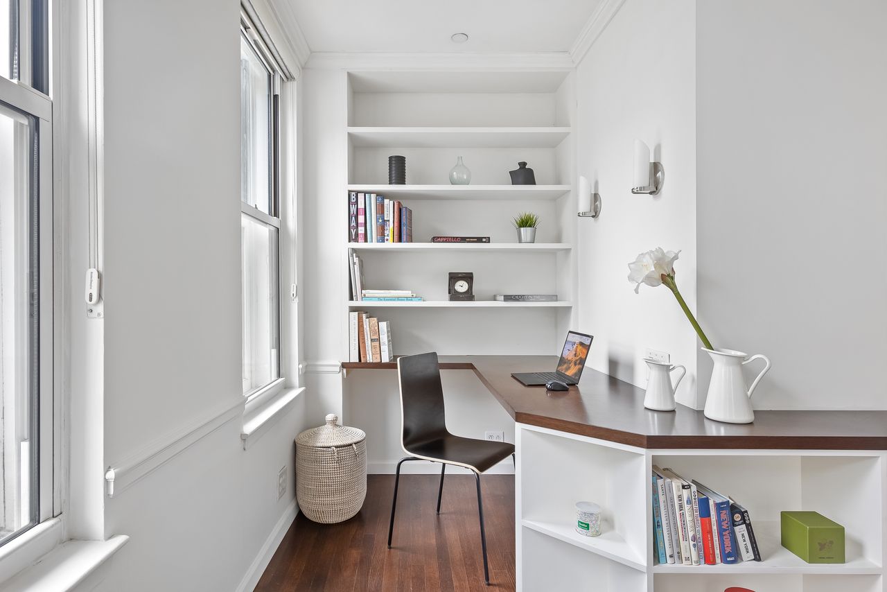 55 Poplar Street, Unit 2C Brooklyn, NY 11201 - Photo 6 of 14 a living room with furniture and a book shelf