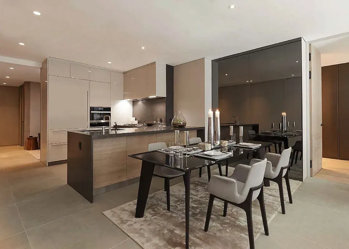 a kitchen with a table and chairs in it