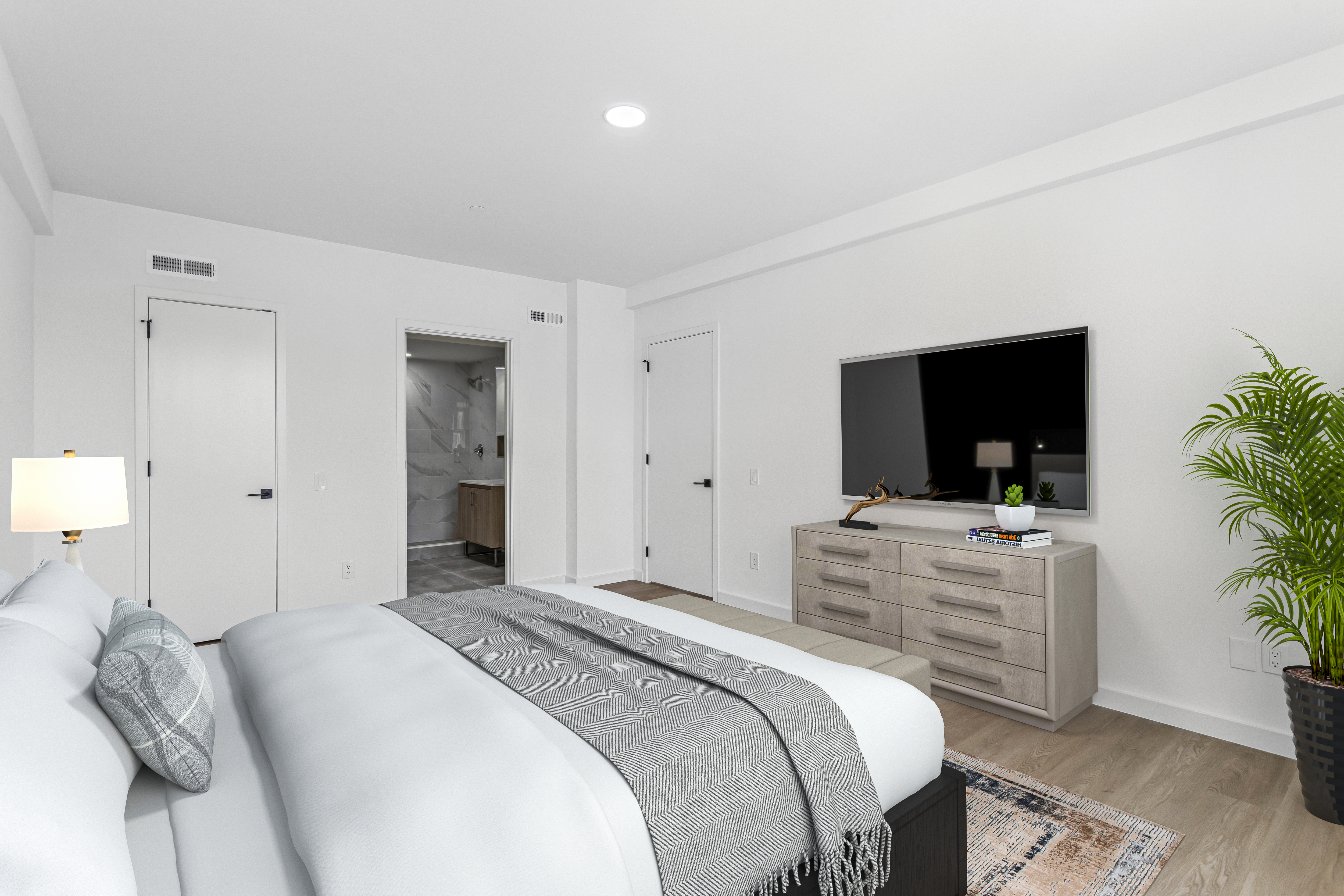 3112 Emmons Avenue, Unit 307 Brooklyn, NY 11235 - Photo 6 of 13 a bedroom with a bed and a flat screen tv