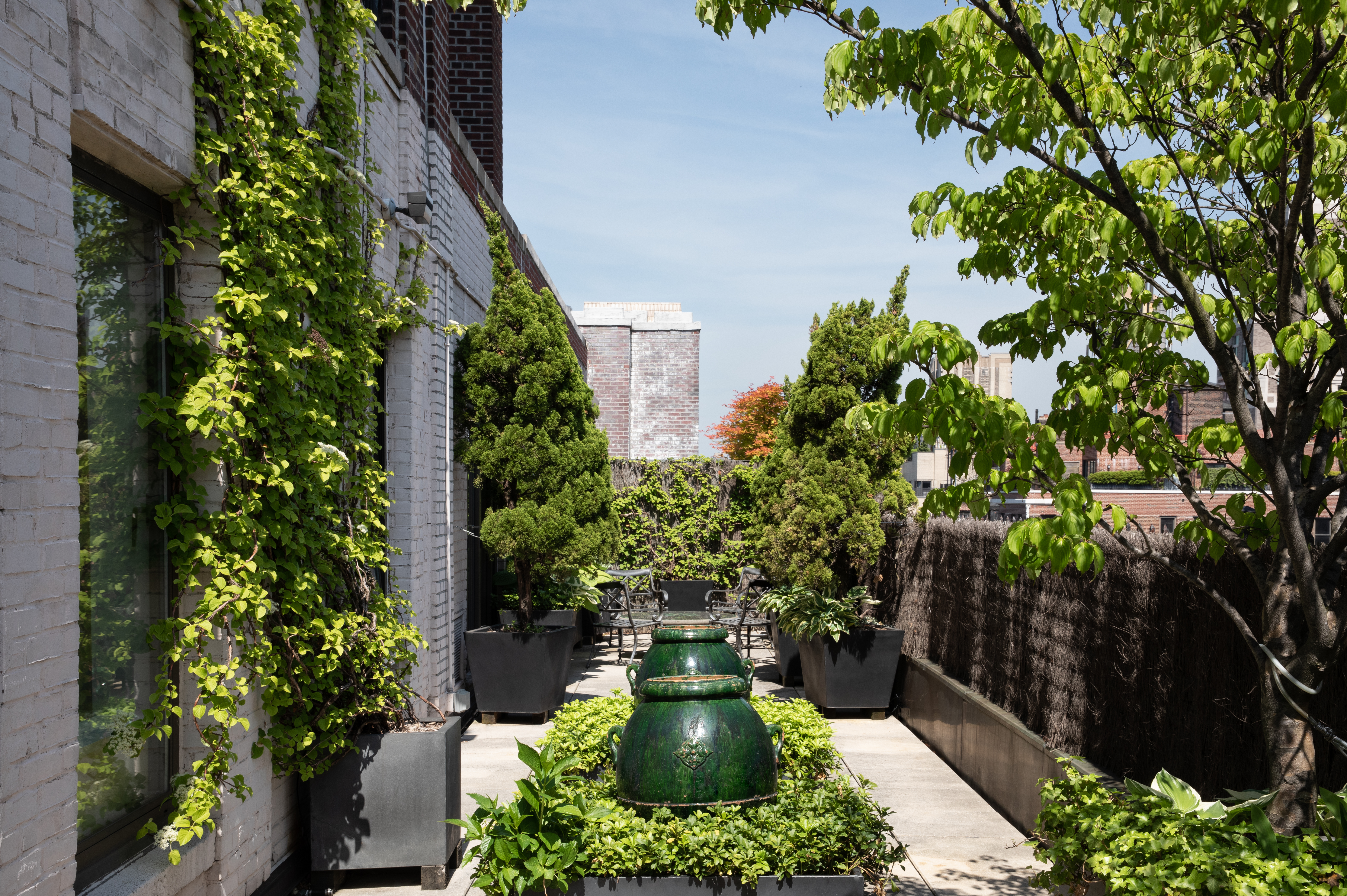 1070 Park Avenue, Unit PHE Manhattan, NY 10128 - Photo 4 of 14 a view of a garden with plants