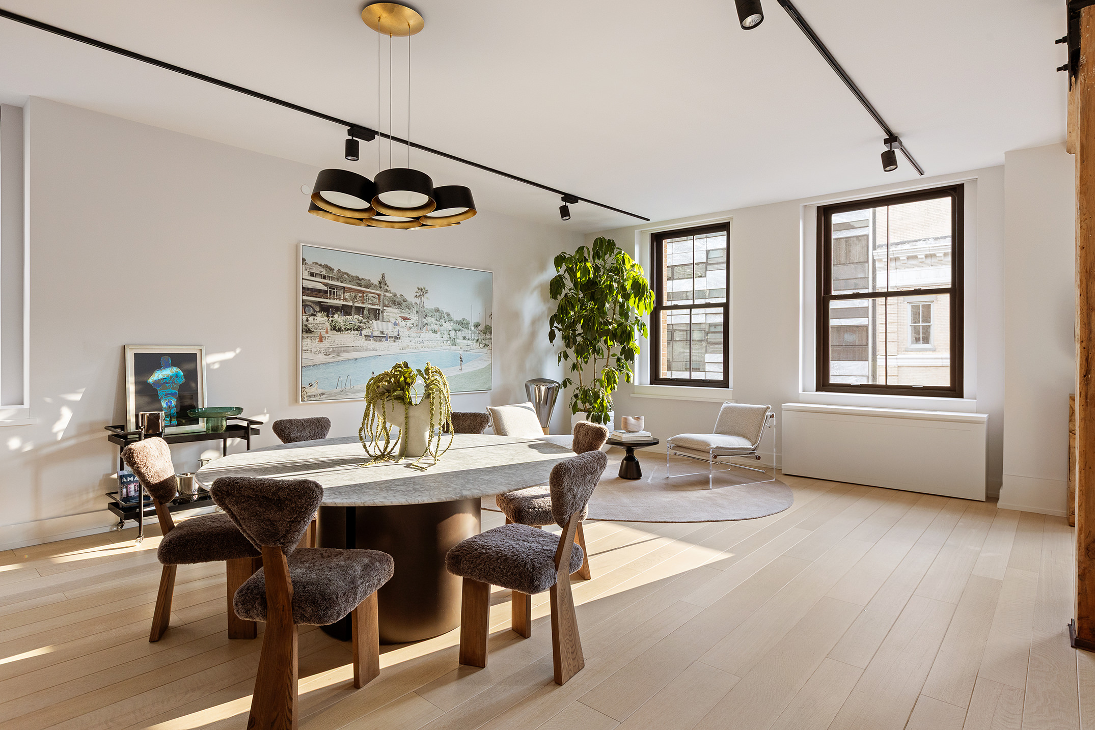 443 Greenwich Street, Unit PHD Manhattan, NY 10013 - Photo 7 of 32 a view of a dining room with furniture window and wooden floor